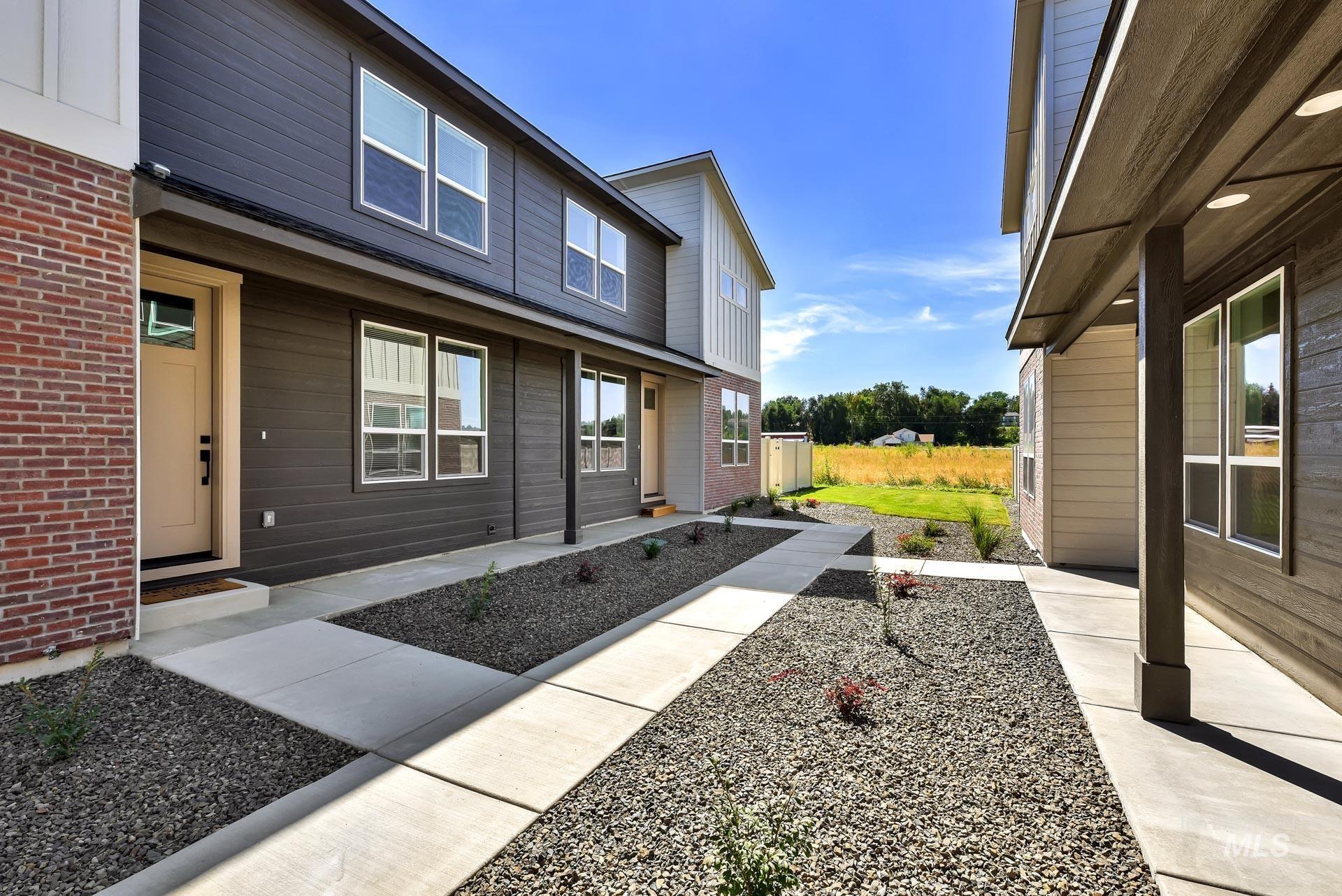 View of property exterior with brick siding