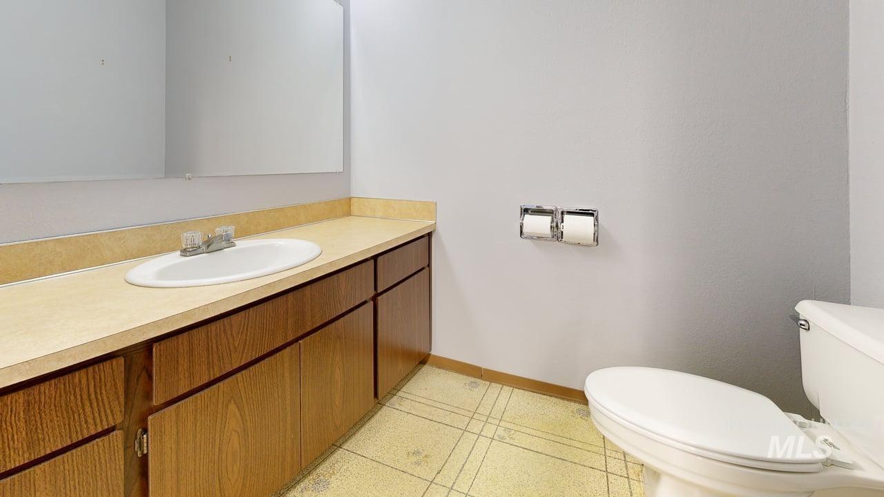 Bathroom featuring vanity and light tile patterned floors