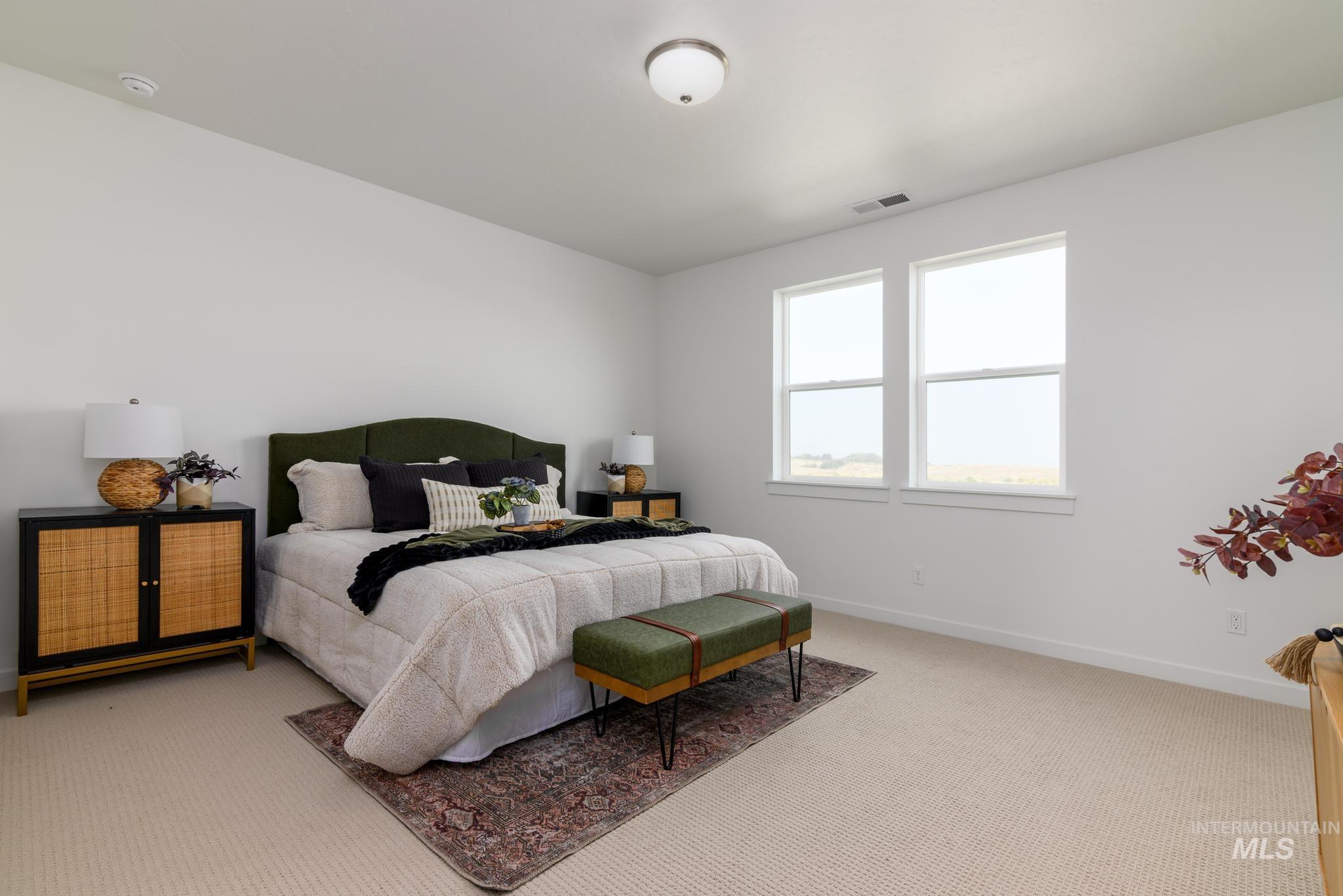 Bedroom with carpet and baseboards