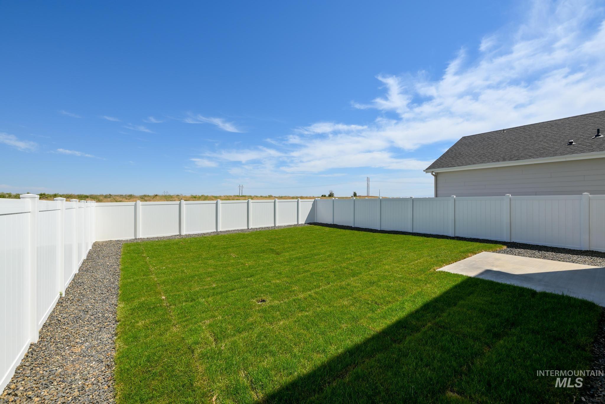View of fenced backyard