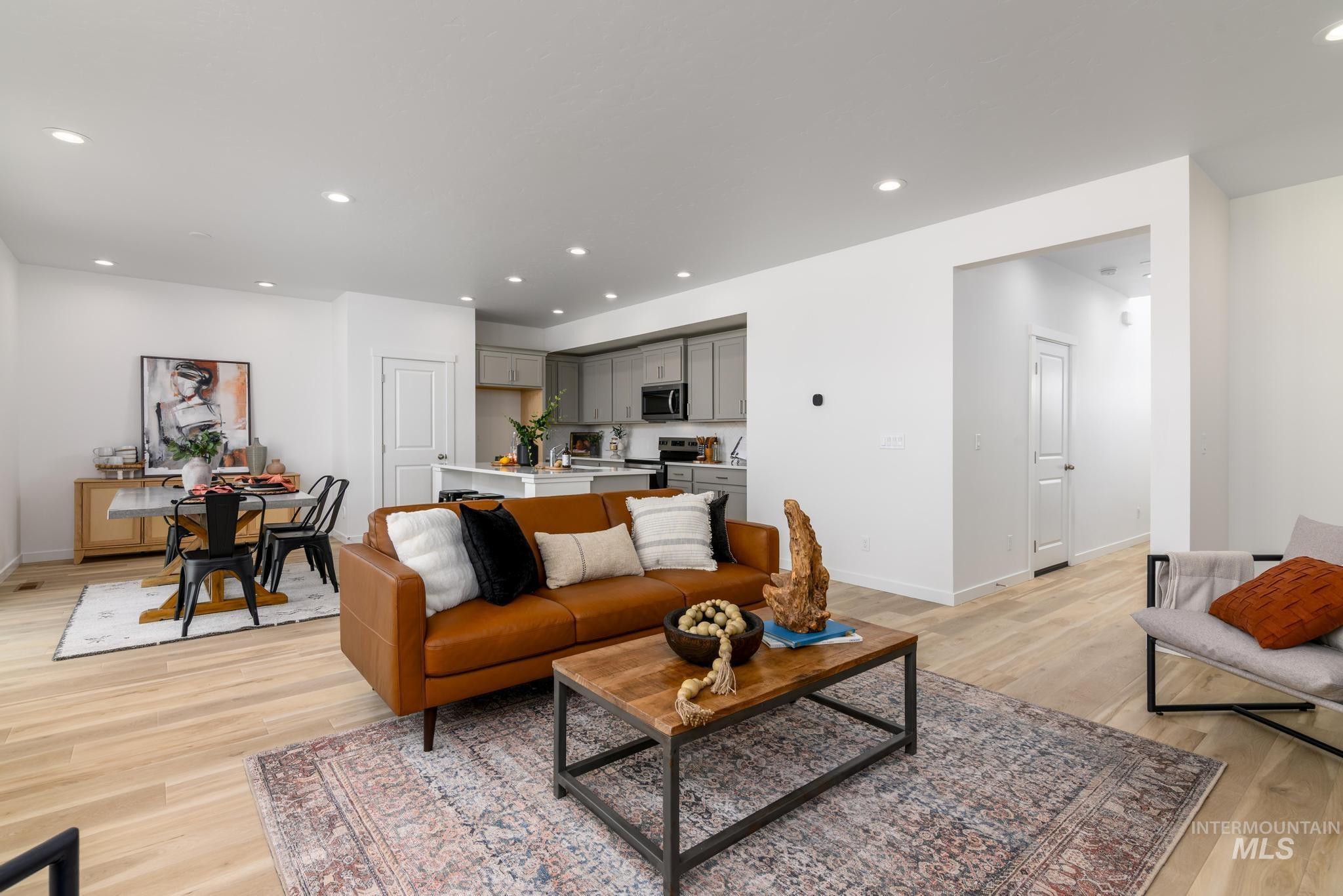 Living room with recessed lighting and light wood finished floors