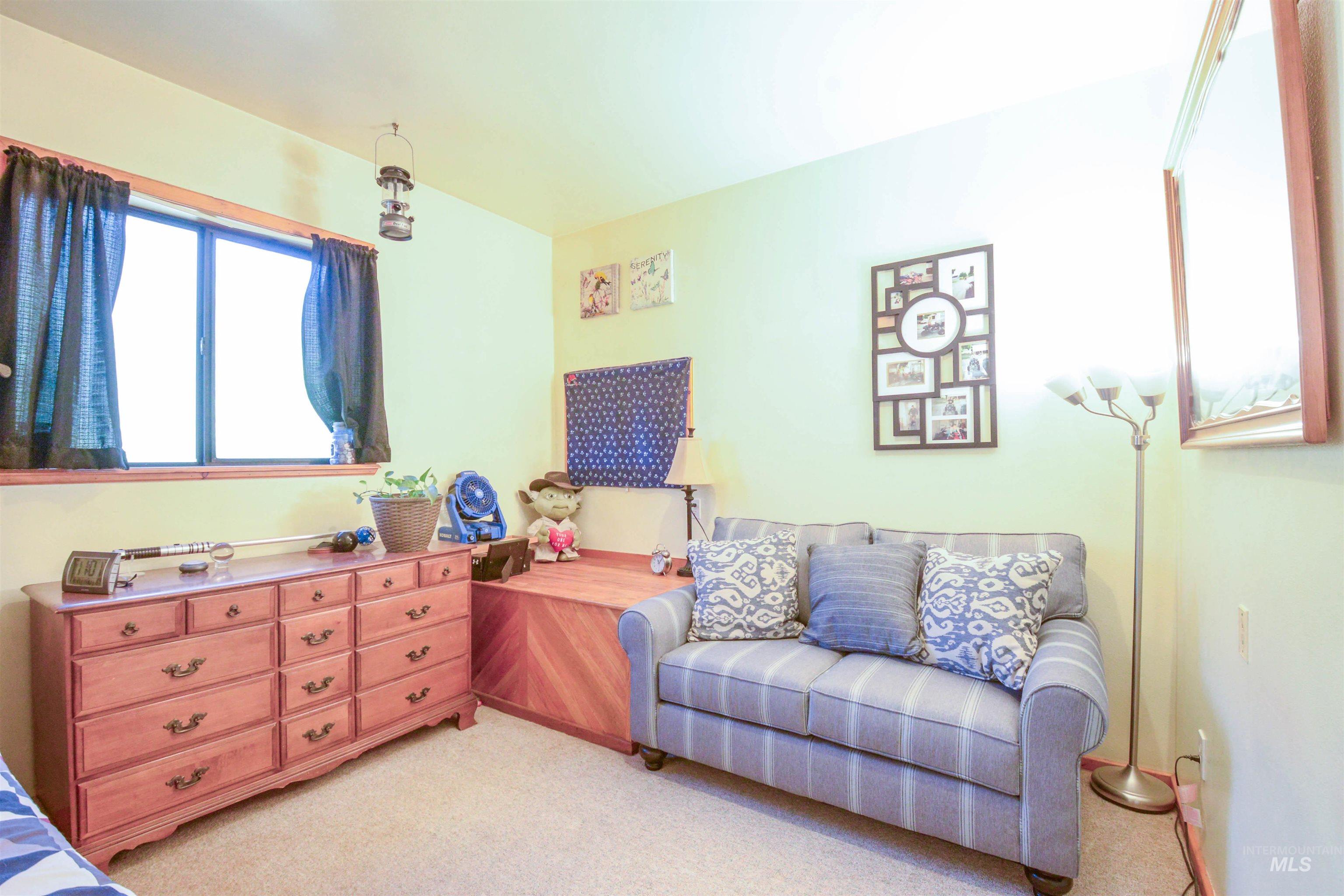 Bedroom with light colored carpet