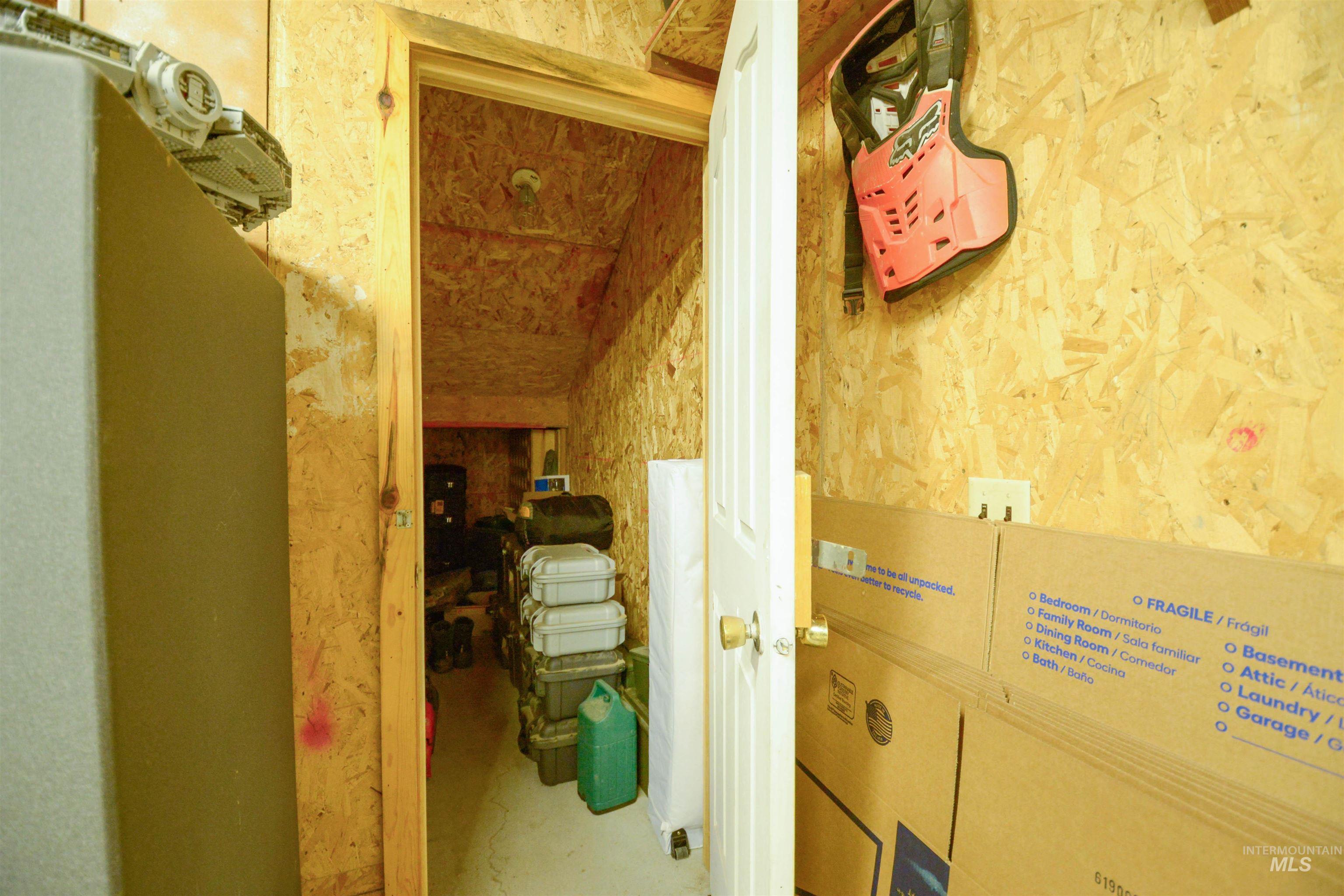 Corridor with concrete floors and wallpapered walls
