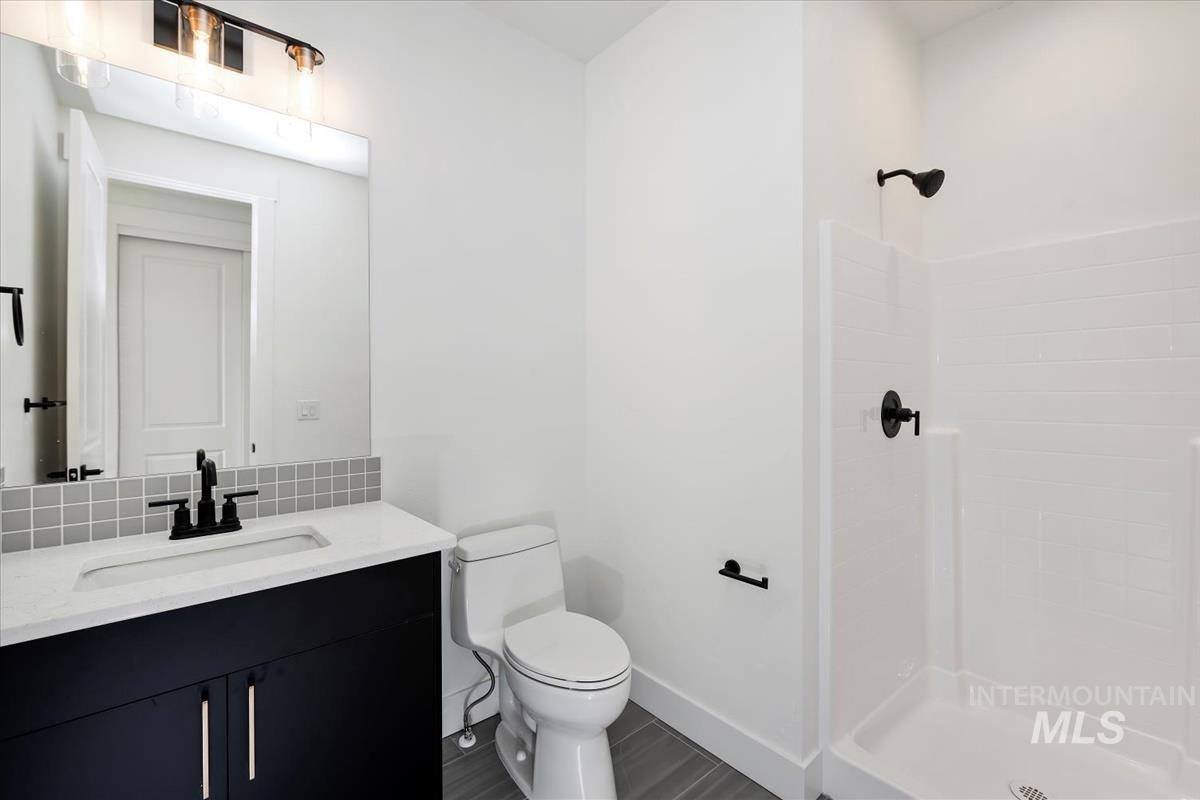 Bathroom with vanity and a stall shower