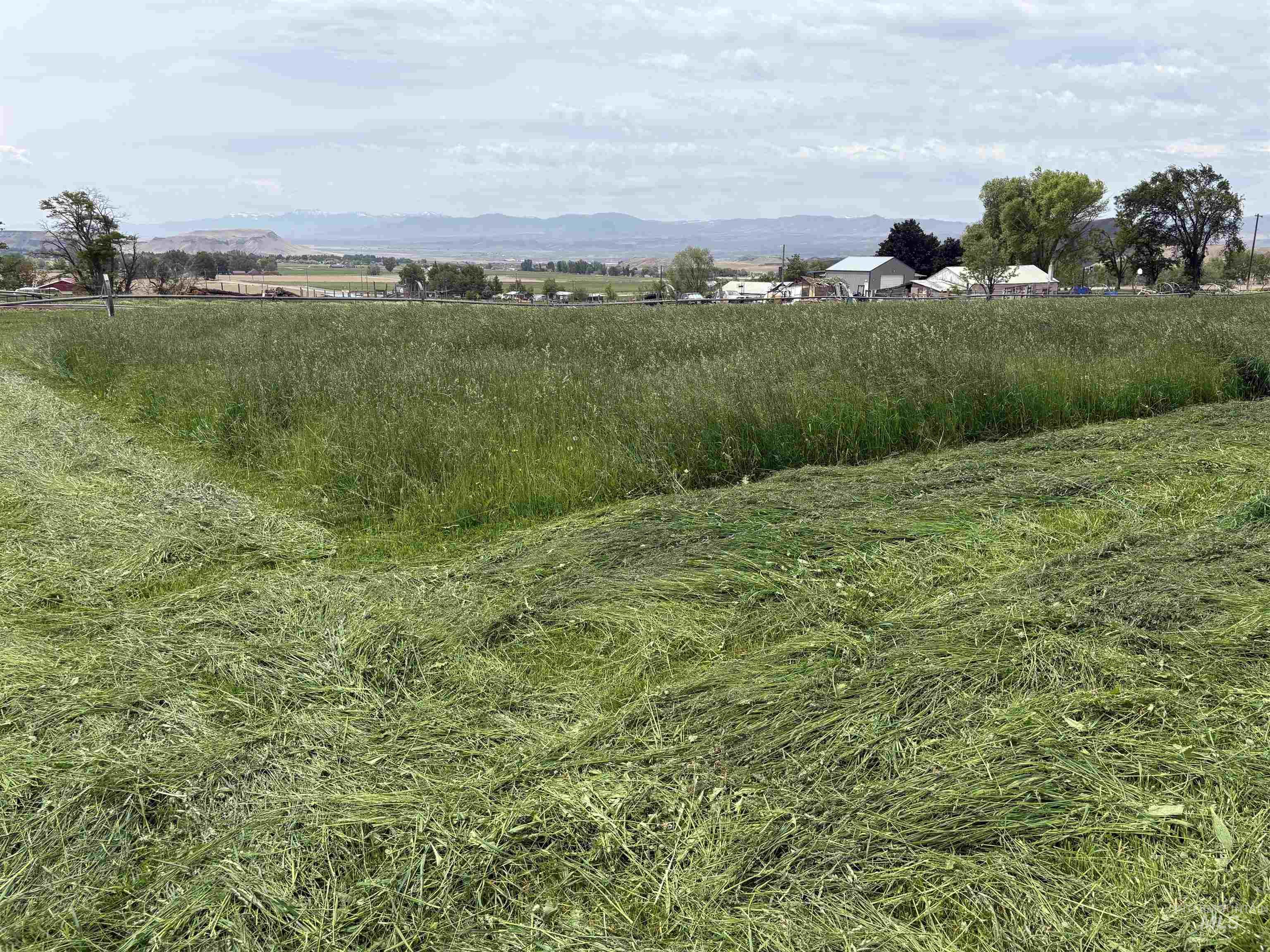 View of mountain backdrop with rural landscape
