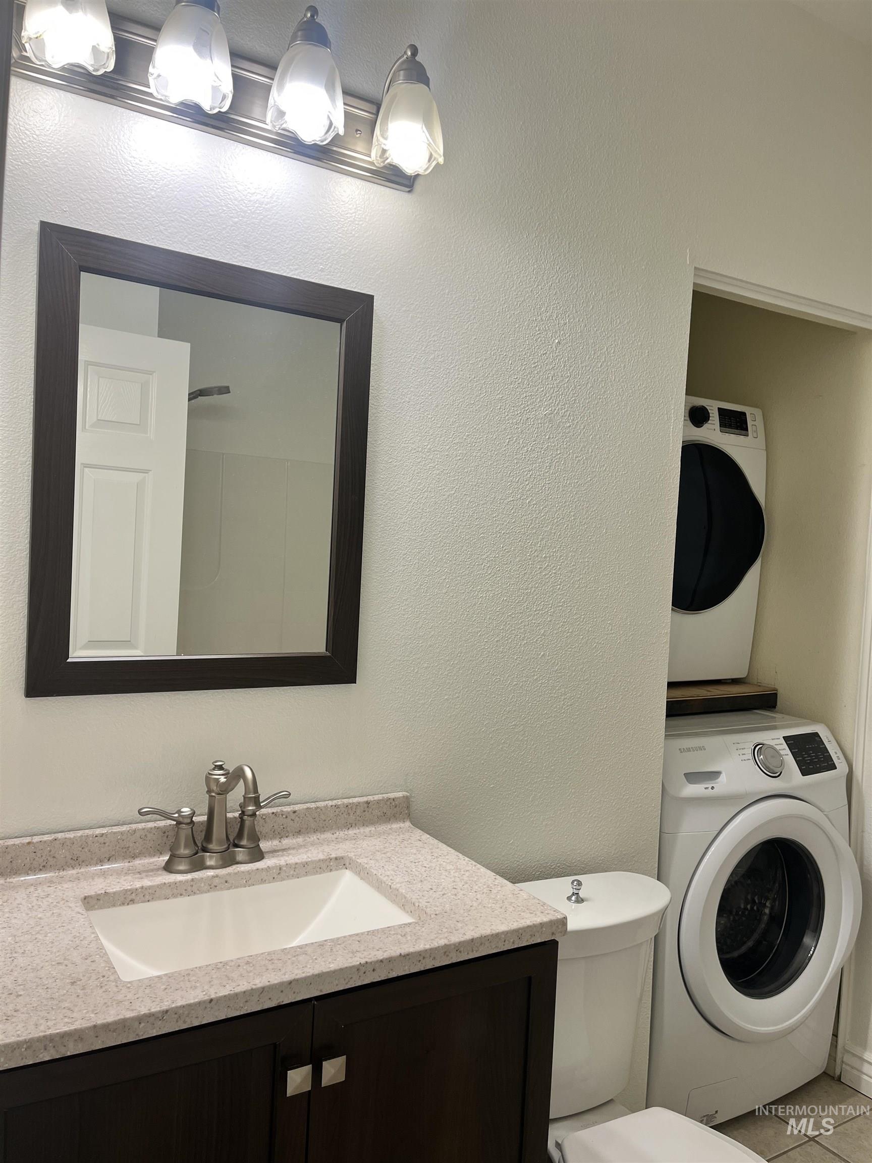 Main level bathroom with stackable washer/dryer included.
