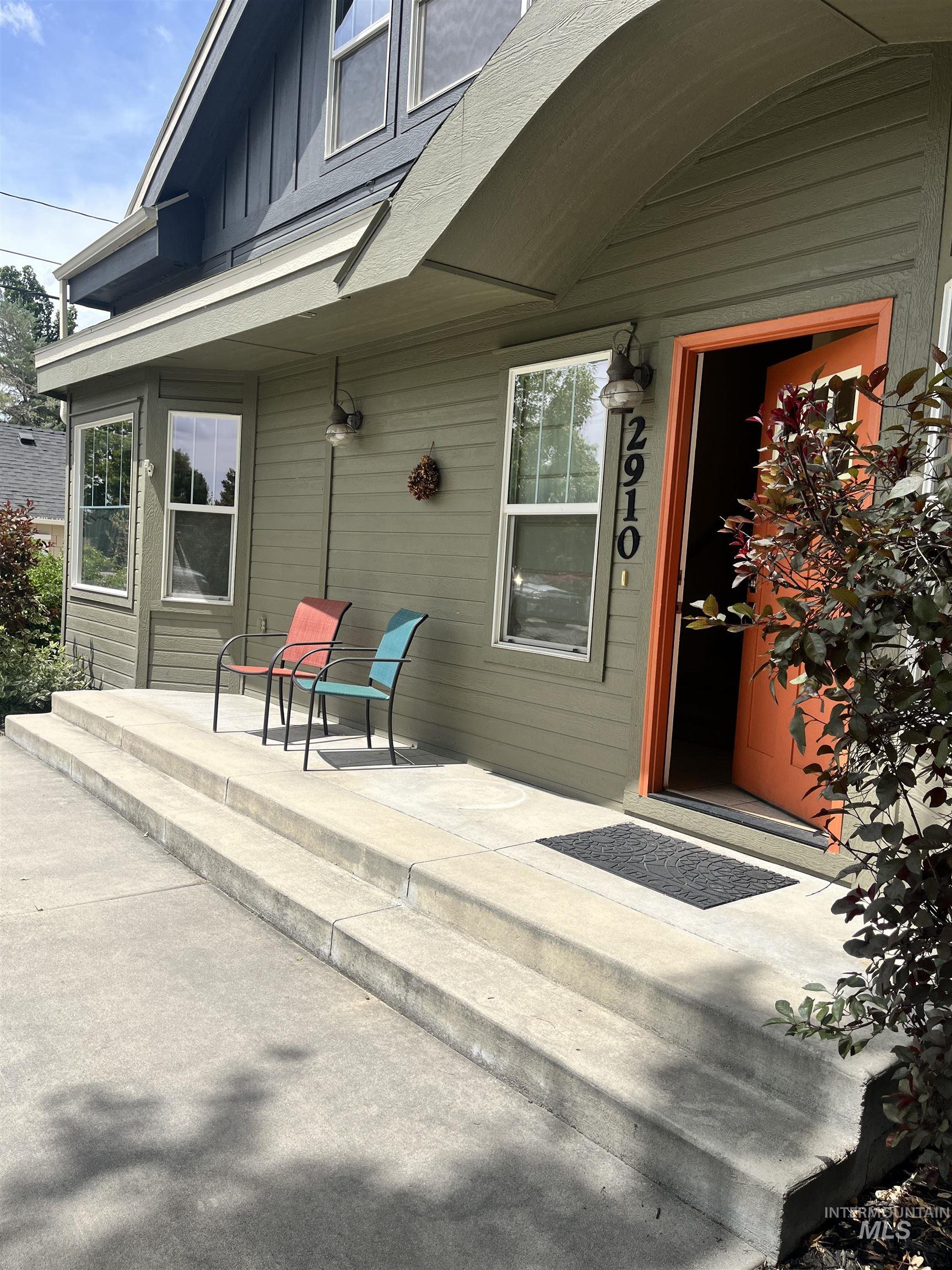Extra Expansive entry porch.  Enjoy the view of the green lawn of the school yard and the flower garden across the street.  Very private & quiet road.