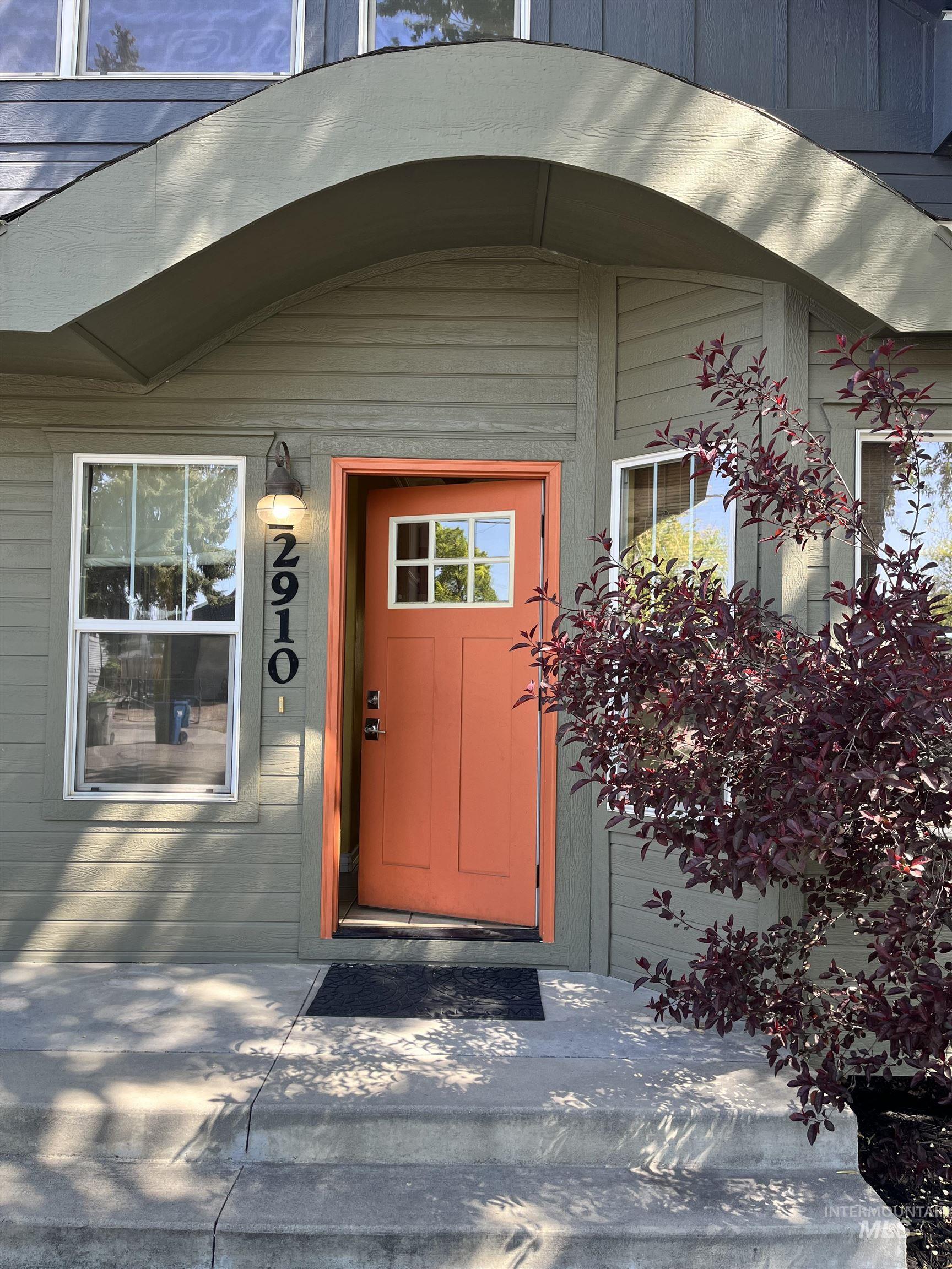 Curved eyebrow gable over entry door, such an adorable north end cottage.