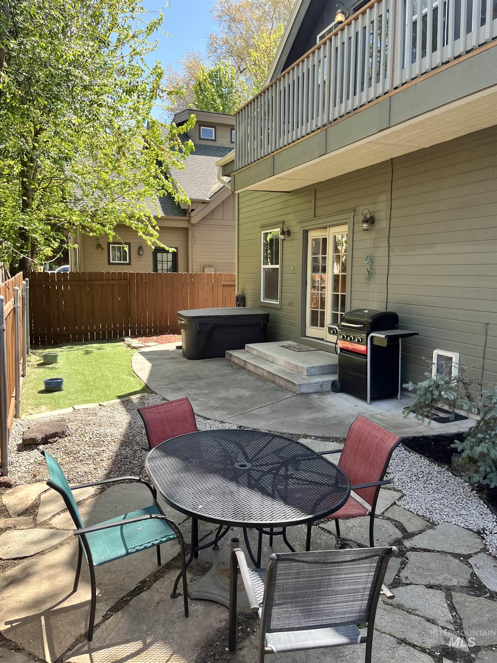 Courtyard seating area on natural stone patio.  Expansive concrete patio plumbed for hot tub.  BBQ area.  Easy care turf yard.  Storage shed plus fully fenced.