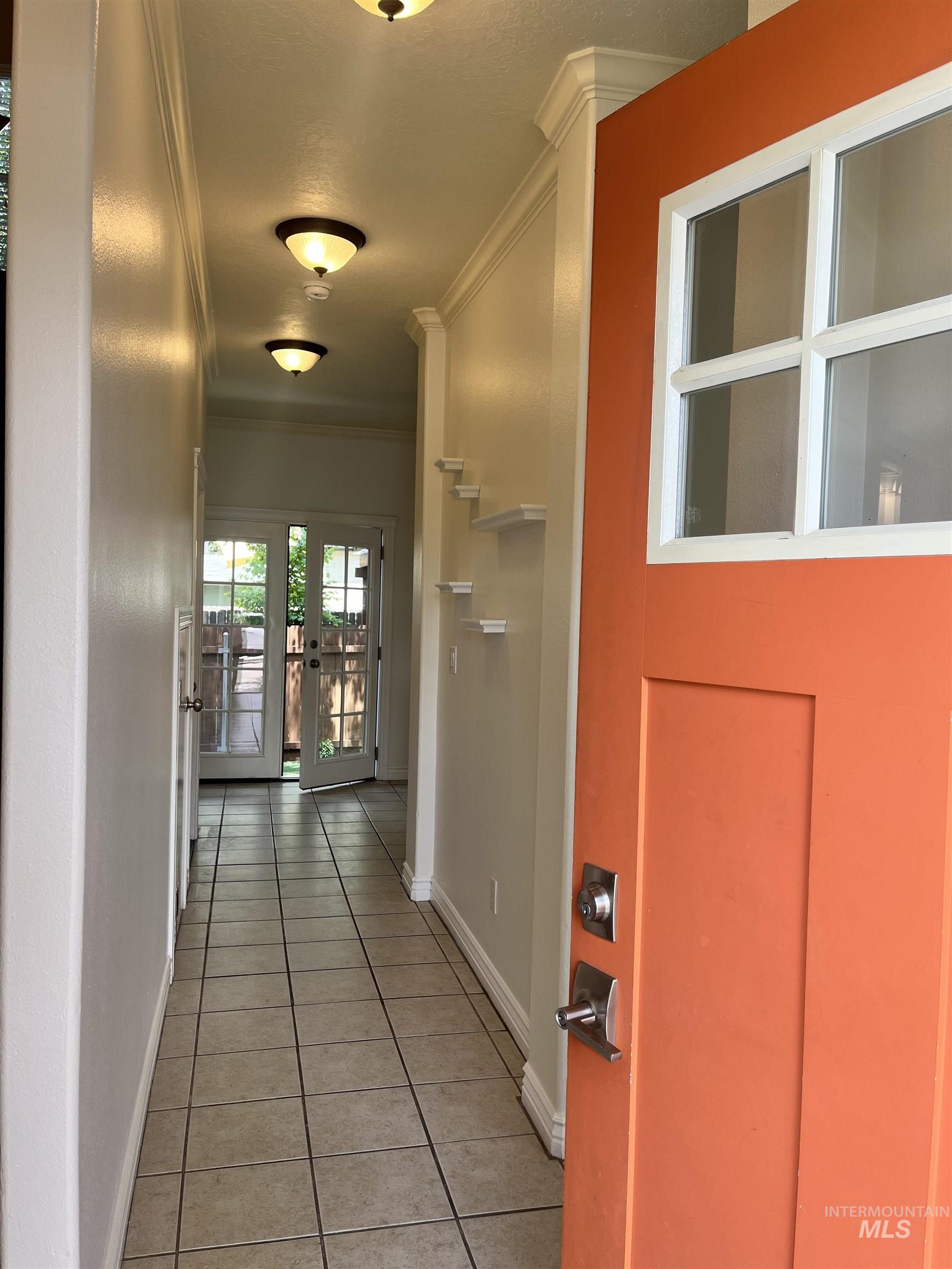 6-pane entry door opens to the entry