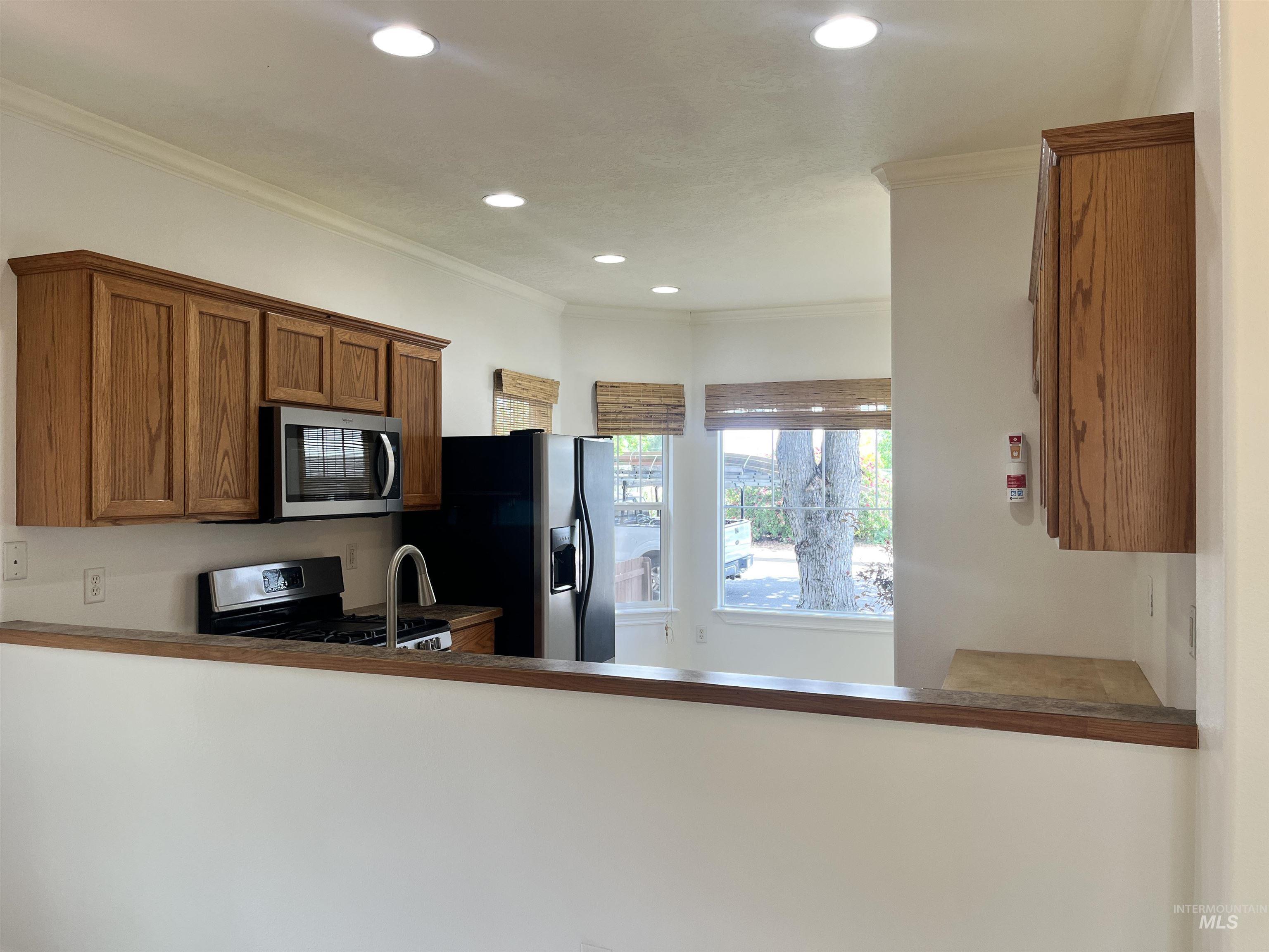 Kitchen opens to great room of the family room/fireplace sitting area.