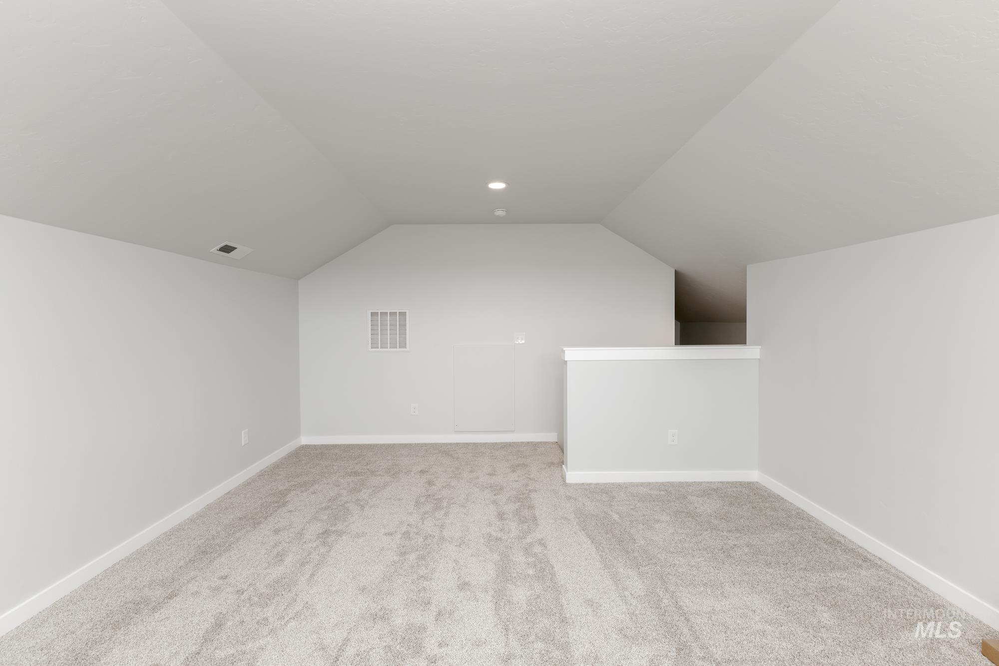 Bonus room with lofted ceiling, carpet floors, and recessed lighting