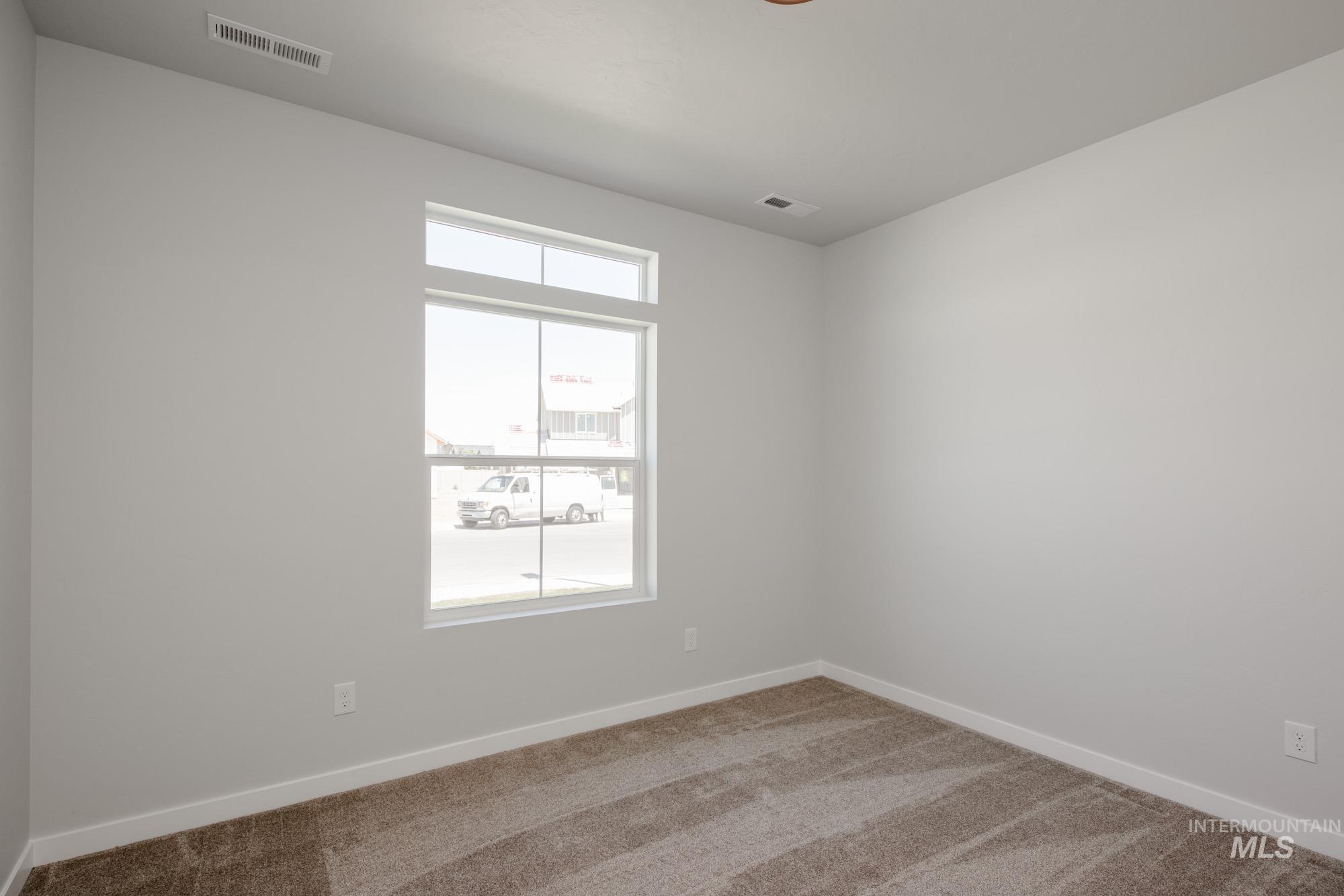 Empty room featuring carpet floors