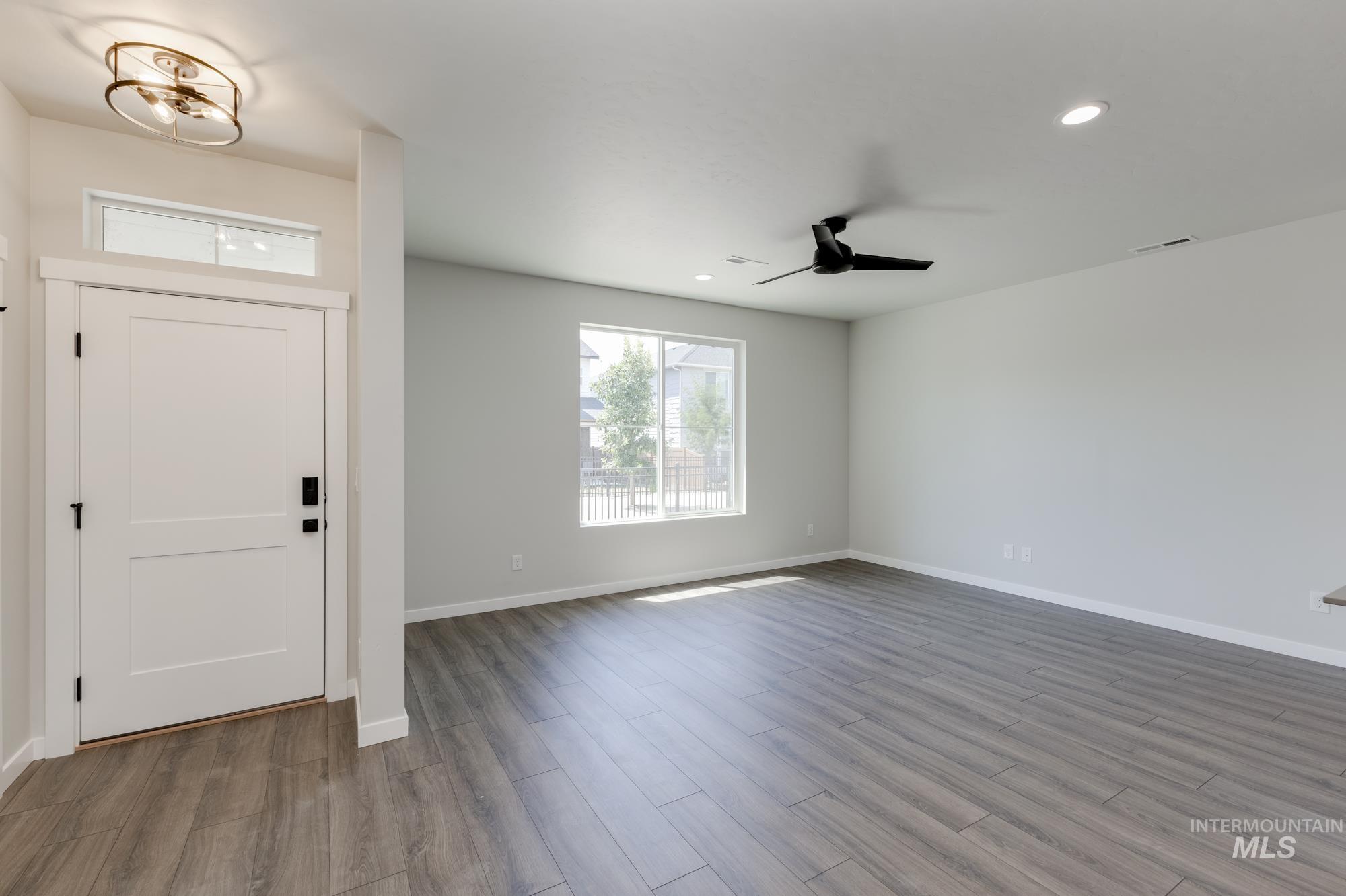 Foyer entrance with wood finished floors, recessed lighting, and ceiling fan