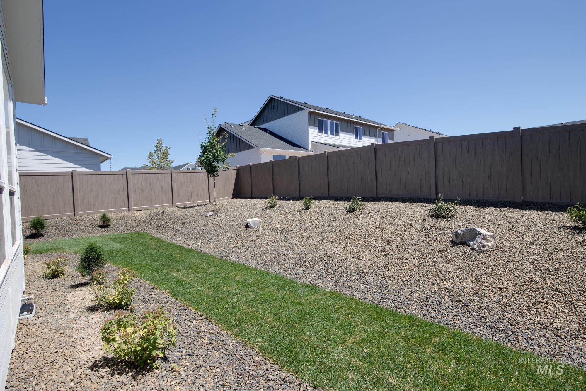 View of fenced backyard