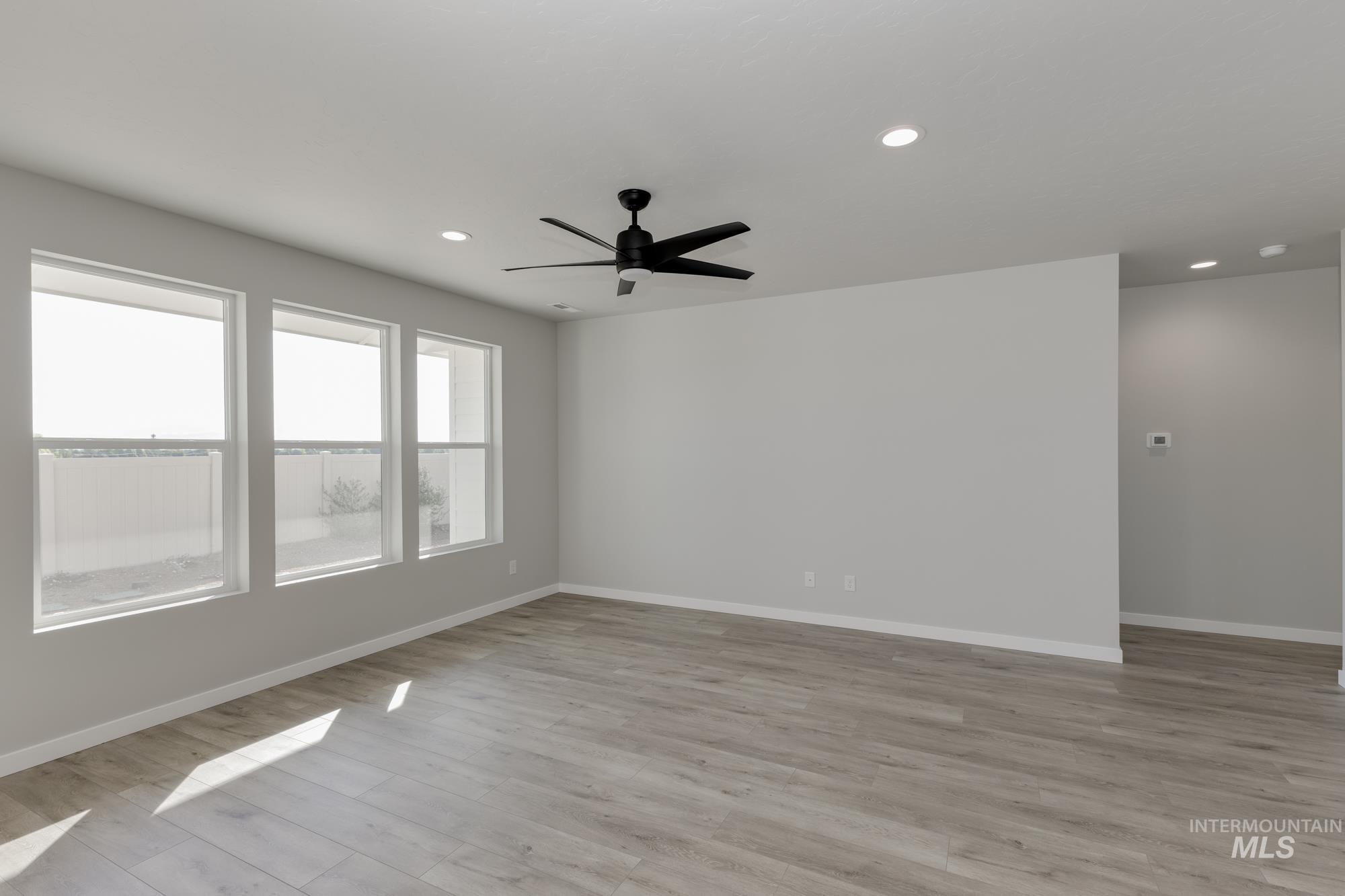 Unfurnished room featuring recessed lighting, light wood finished floors, and a ceiling fan