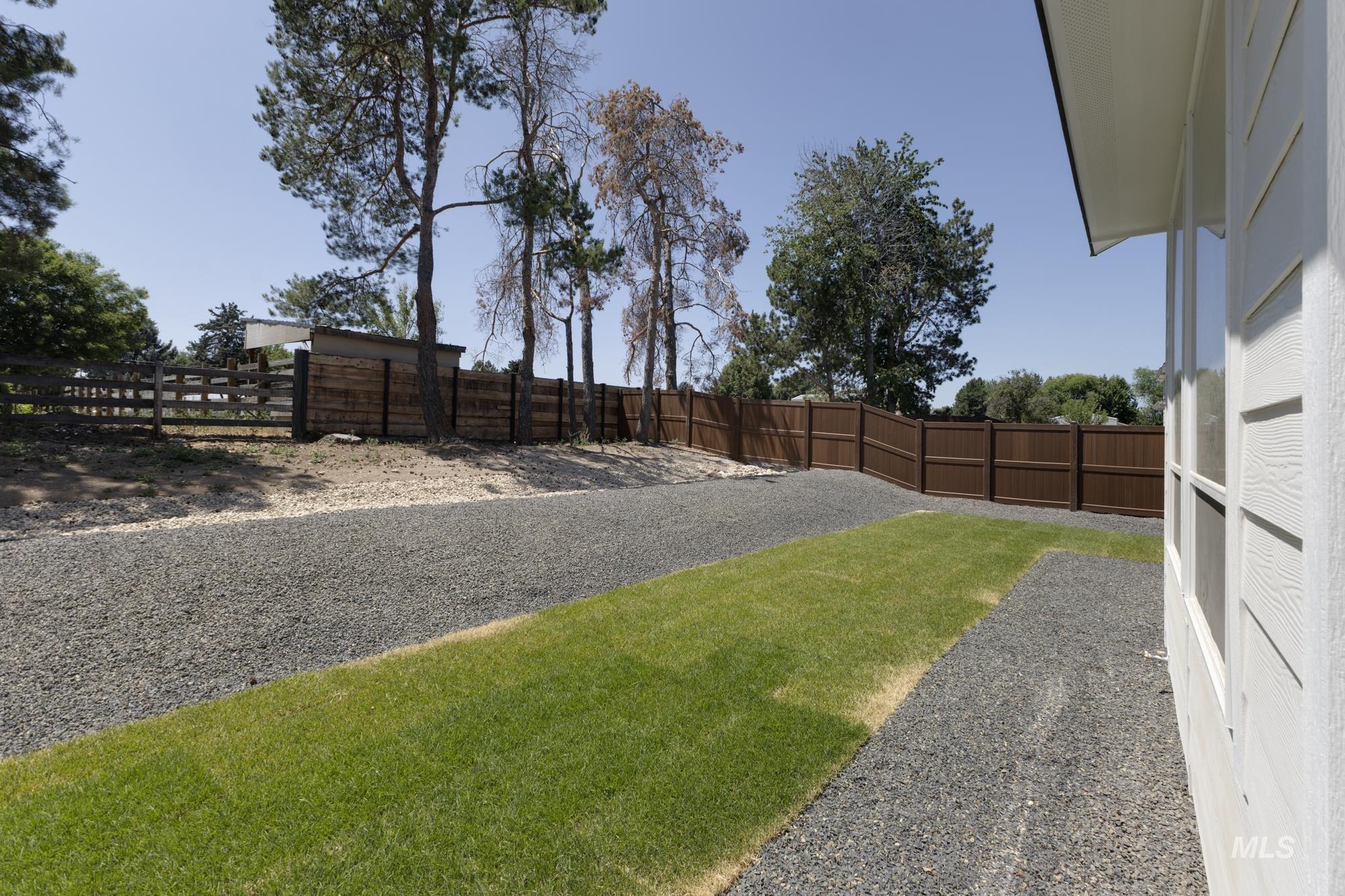 View of fenced backyard