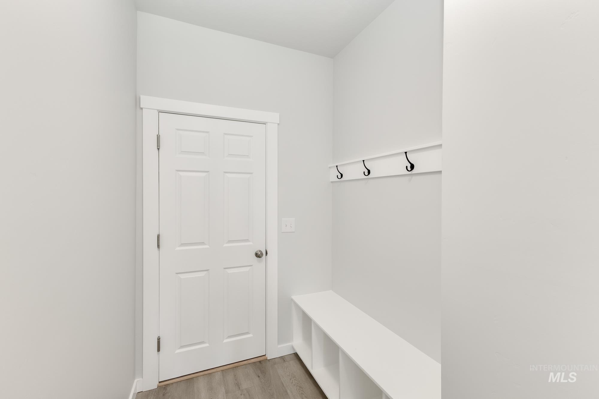 Mudroom with light wood finished floors