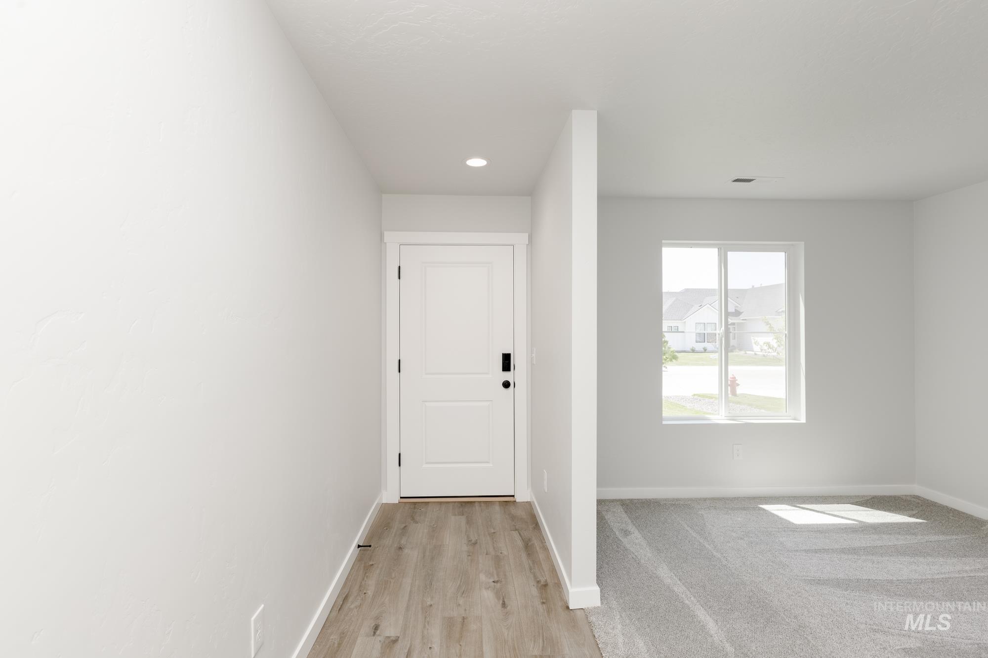 Entryway featuring recessed lighting and light wood finished floors