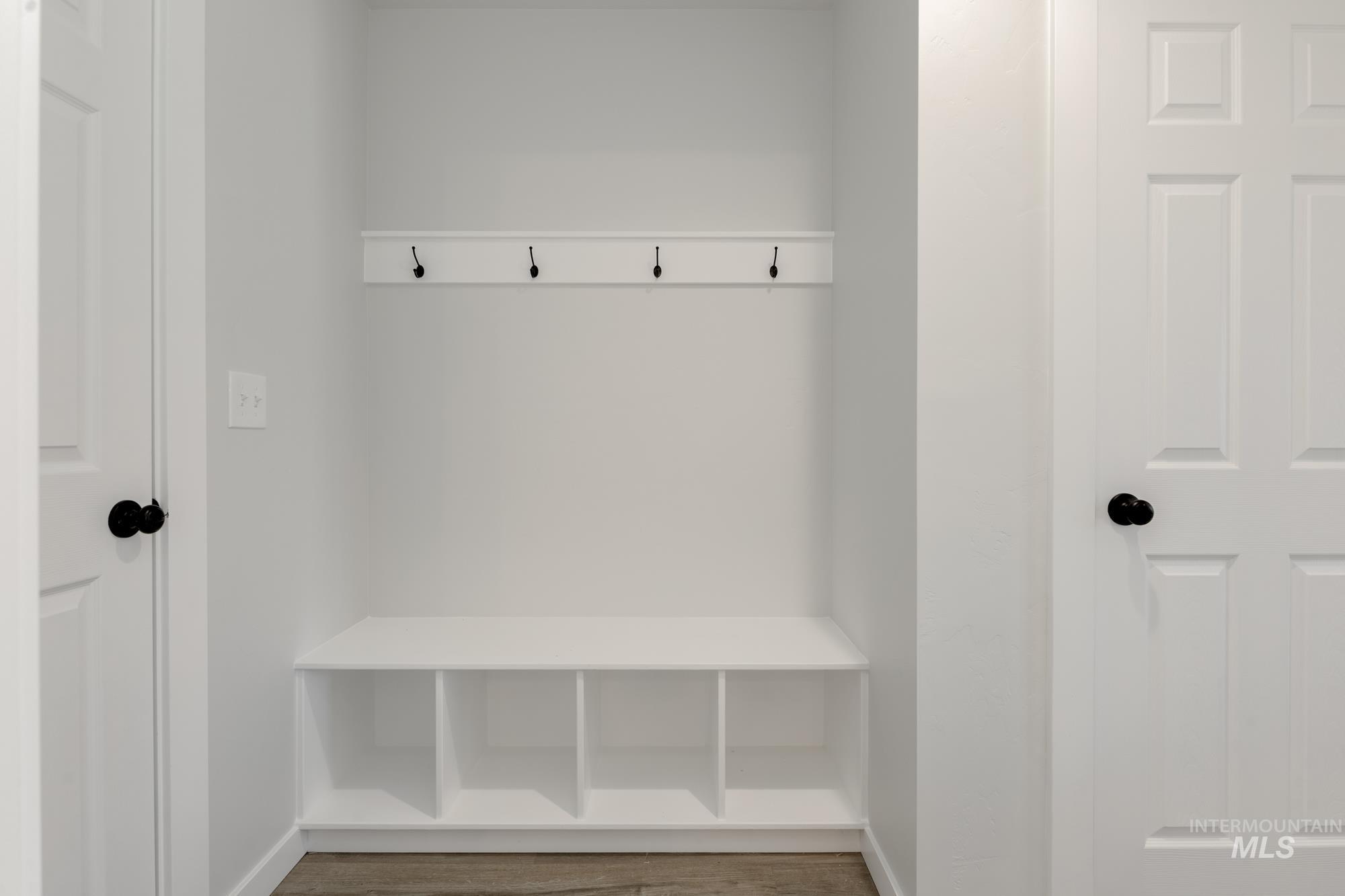 Mudroom with wood finished floors