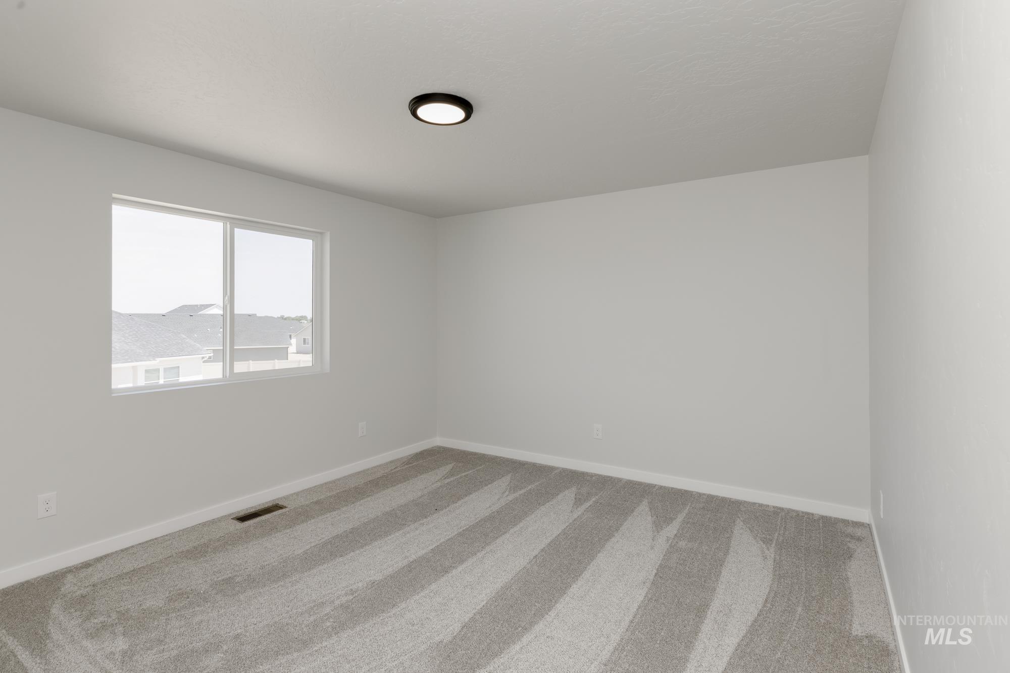 Spare room with carpet floors