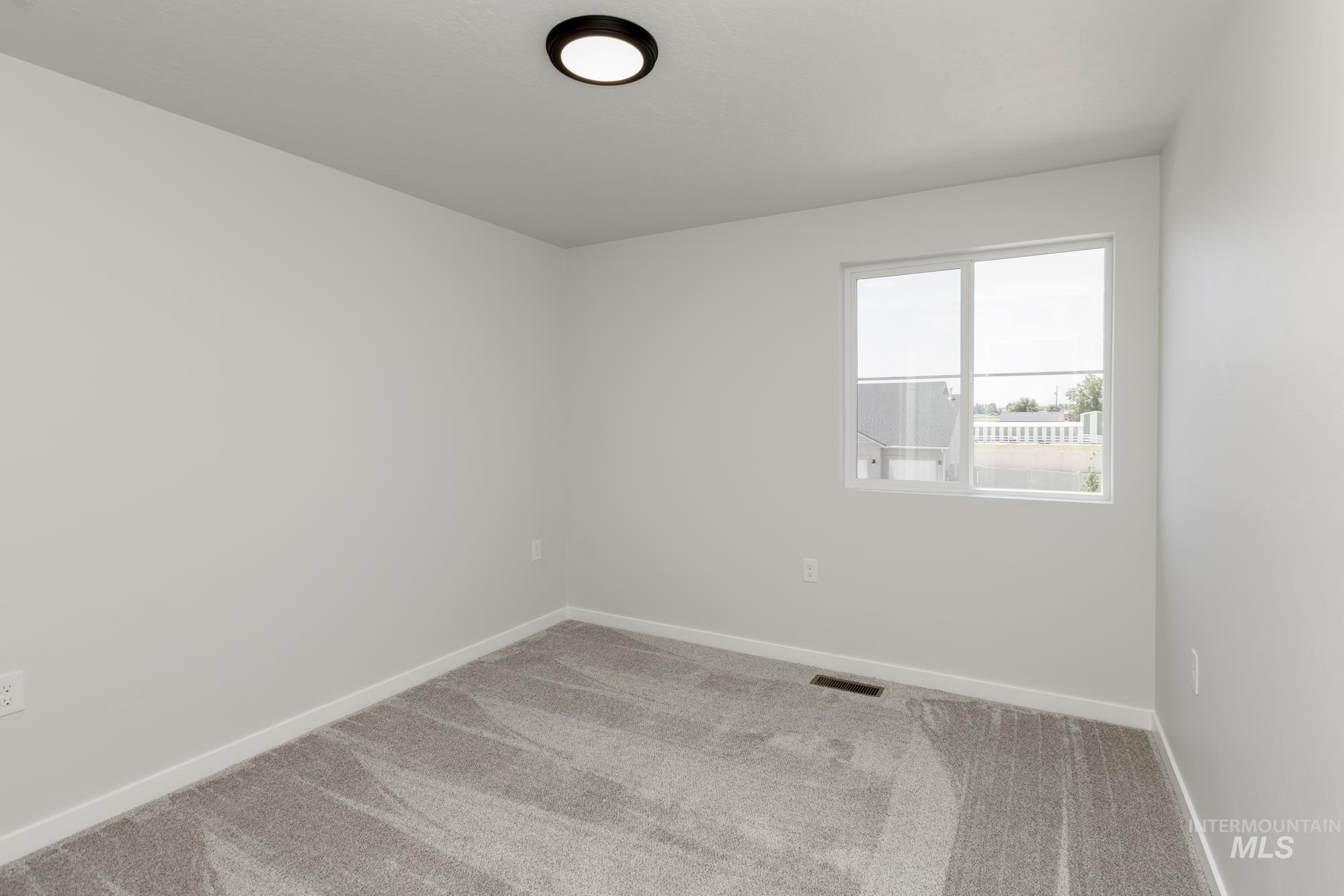 Empty room featuring carpet floors