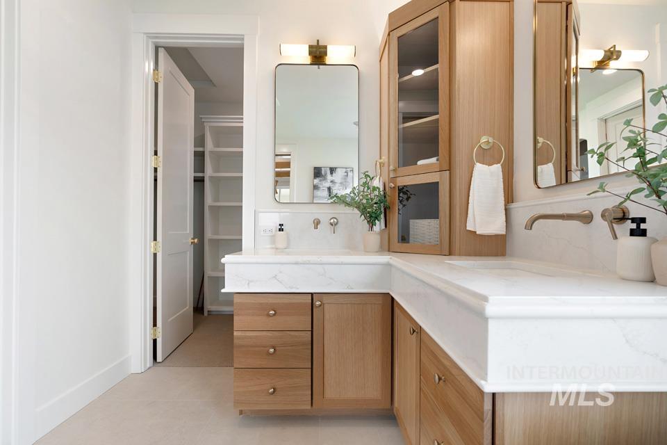Bathroom featuring vanity and light tile patterned floors