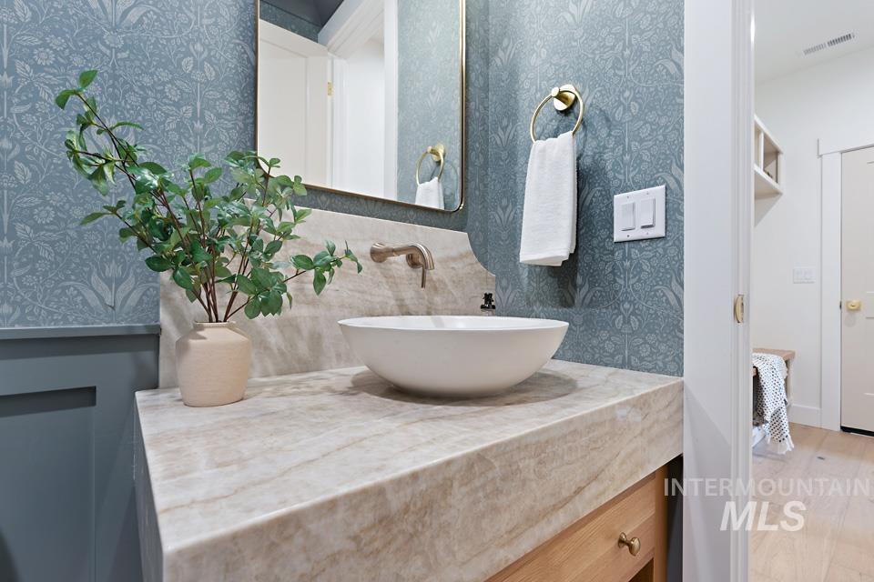 Bathroom featuring vanity and light wood-style flooring