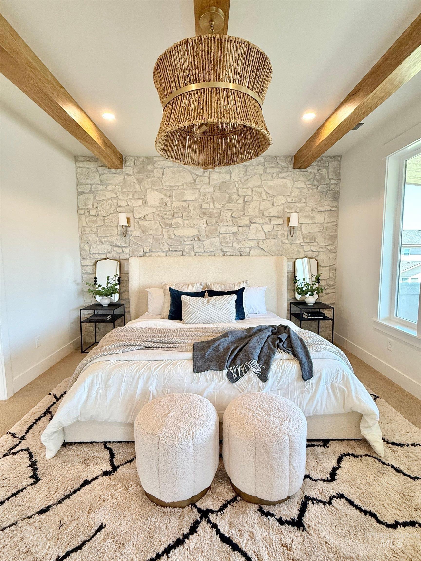 Bedroom featuring beam ceiling and carpet