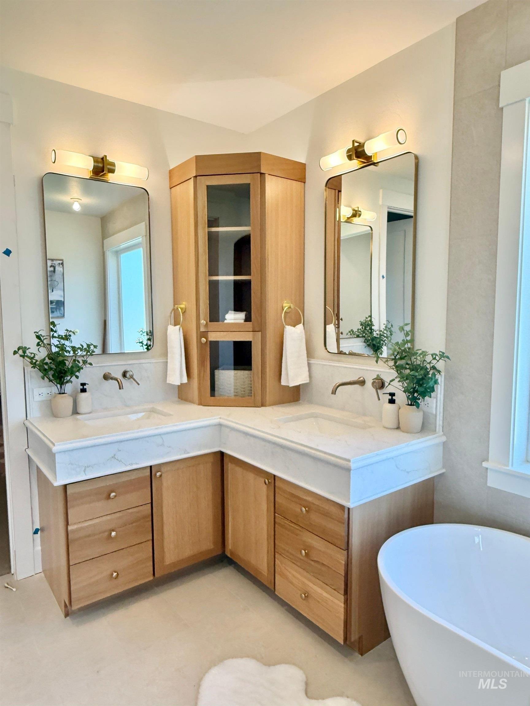 Bathroom with double vanity and a soaking tub