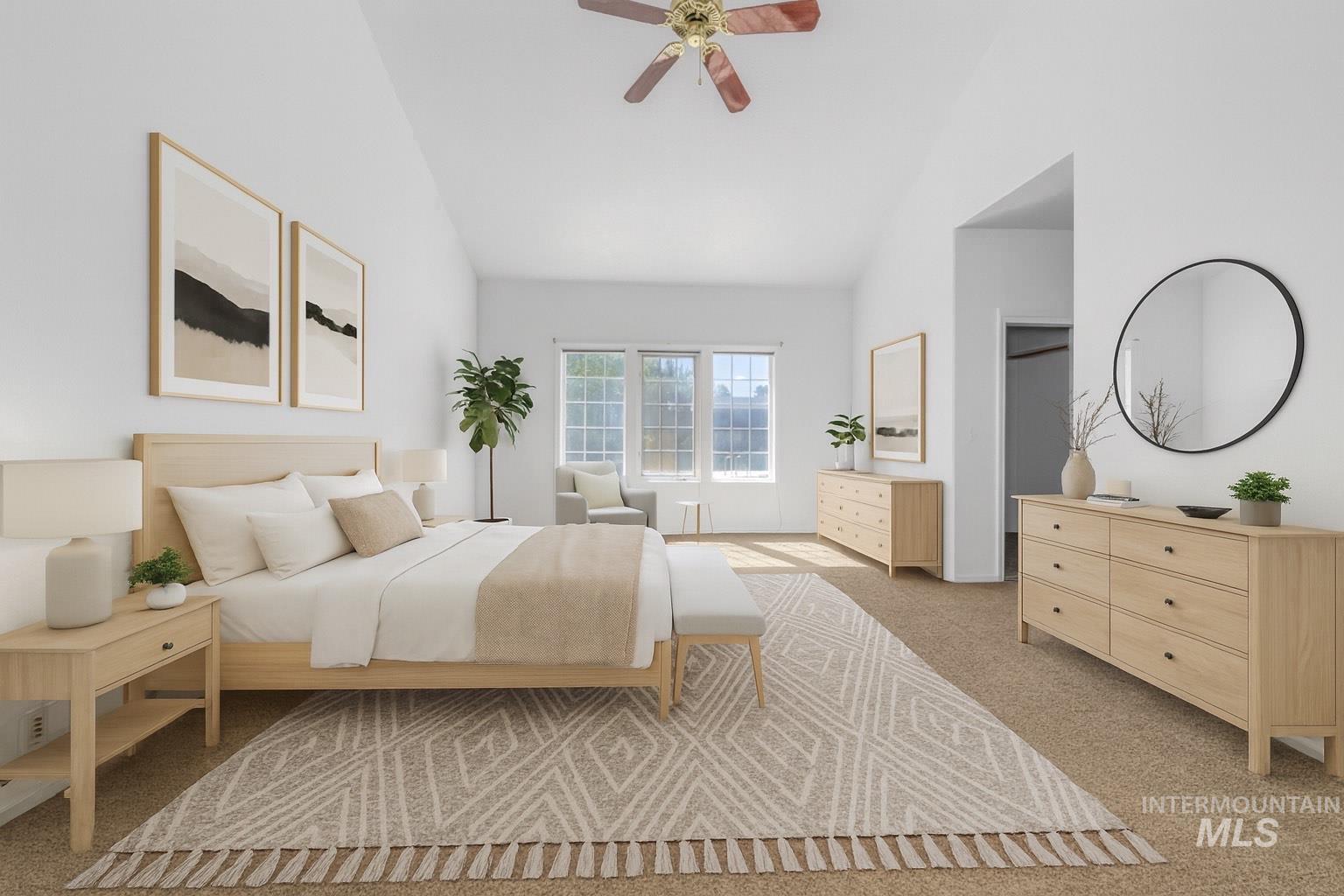 Bedroom with light colored carpet, a ceiling fan, and high vaulted ceiling