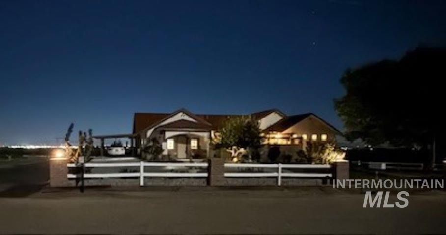 View of front facade with a fenced front yard