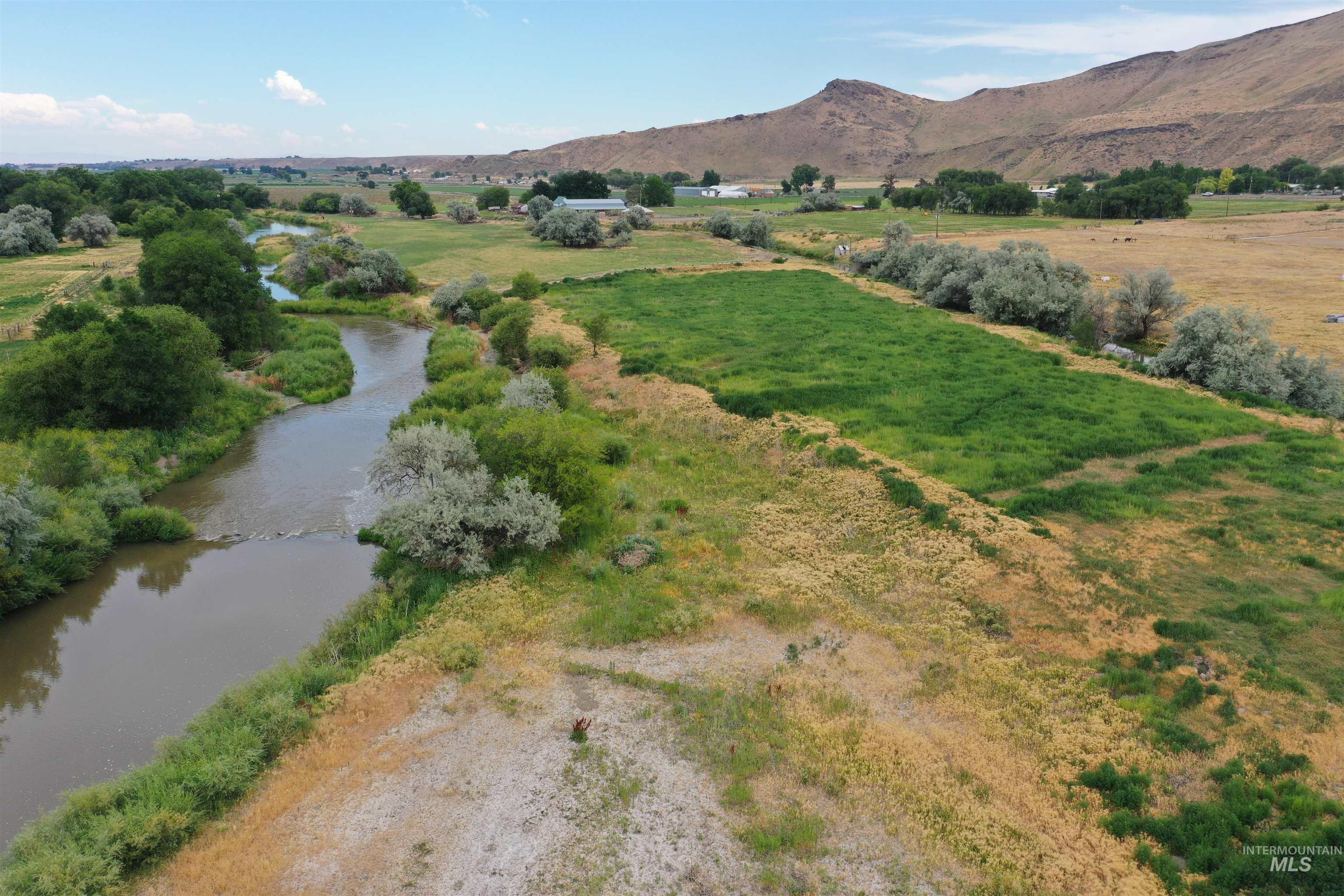 Aerial overview of property's location with mountains and rural landscape