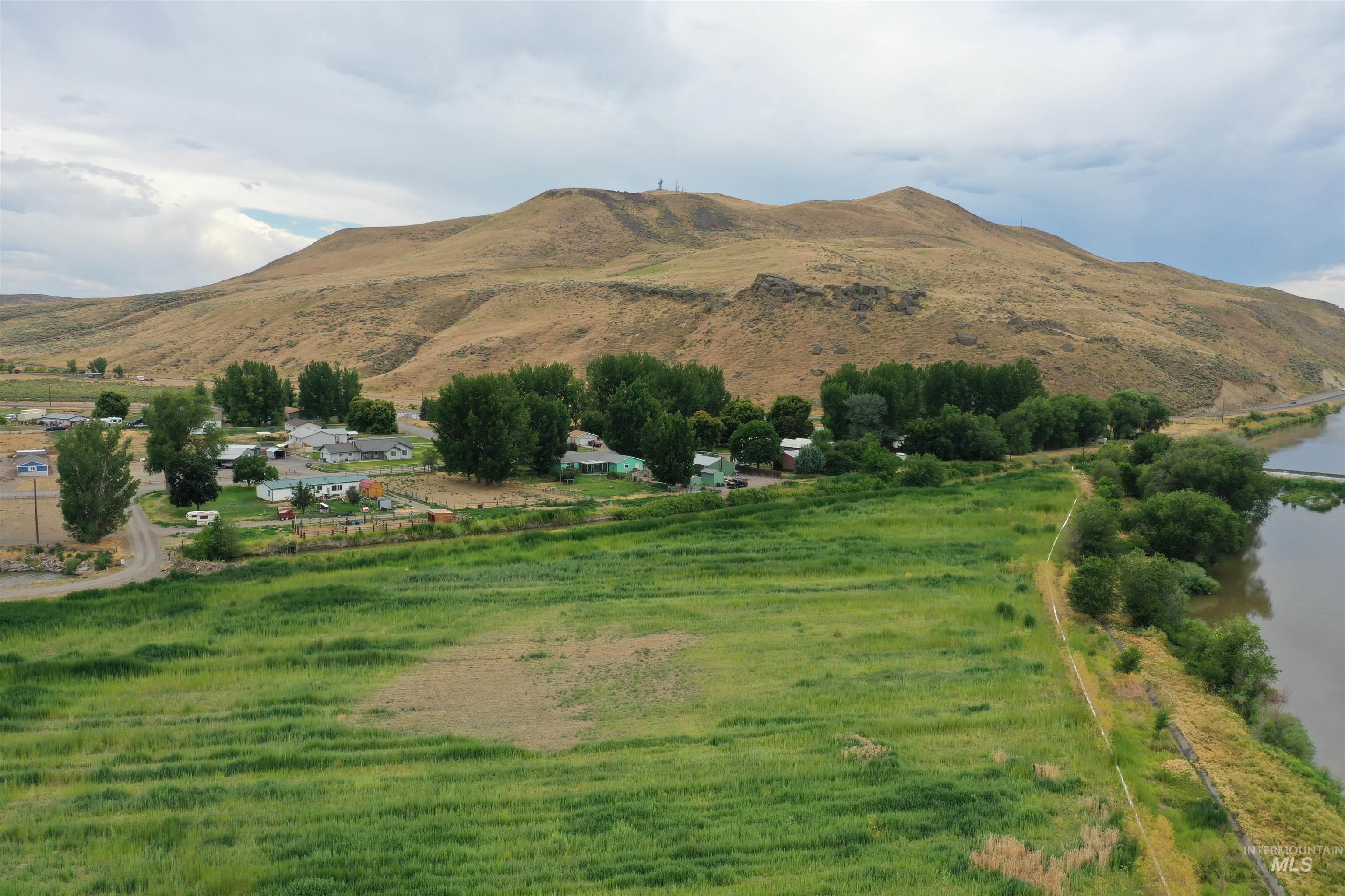 Mountain view featuring a large body of water and rural landscape