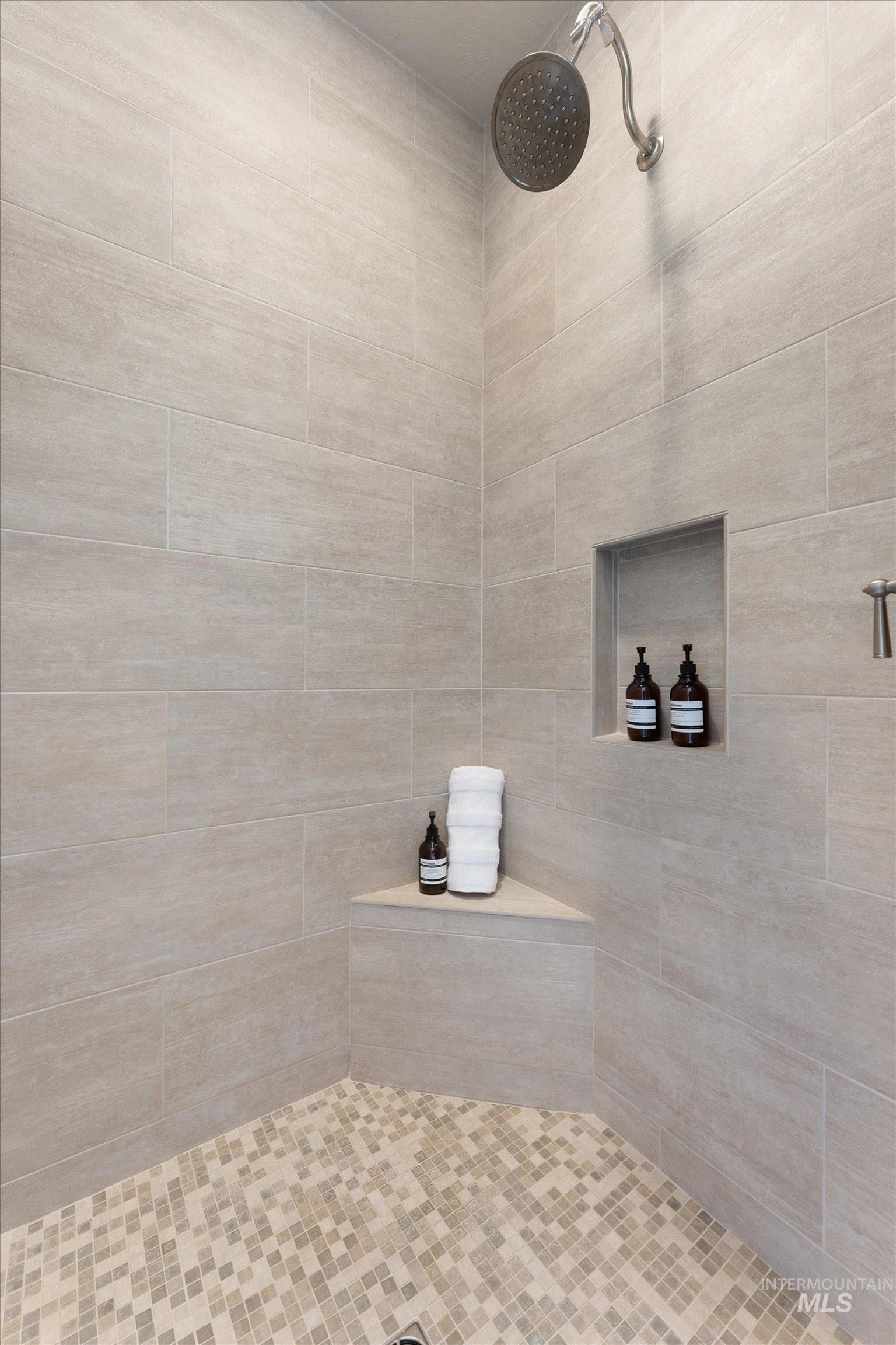 Bathroom featuring tiled shower
