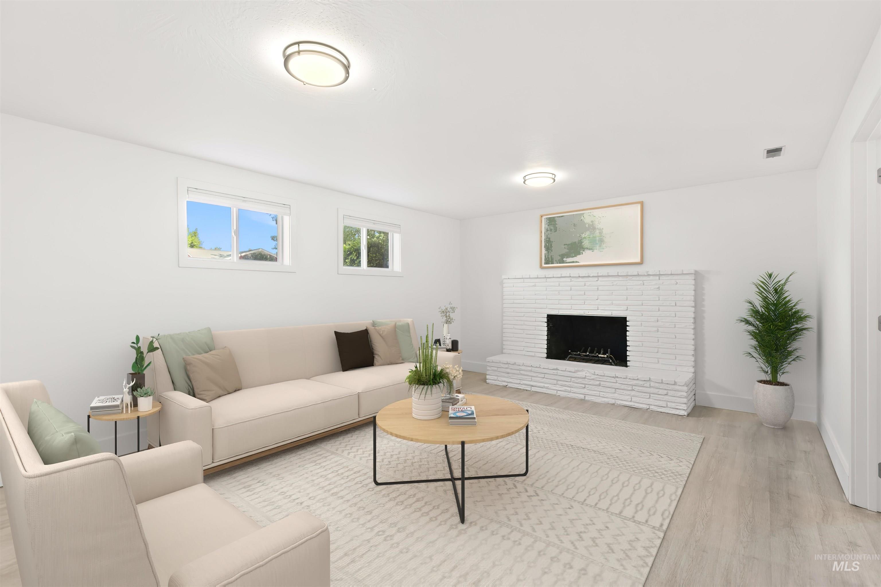 Living area with wood finished floors and a fireplace