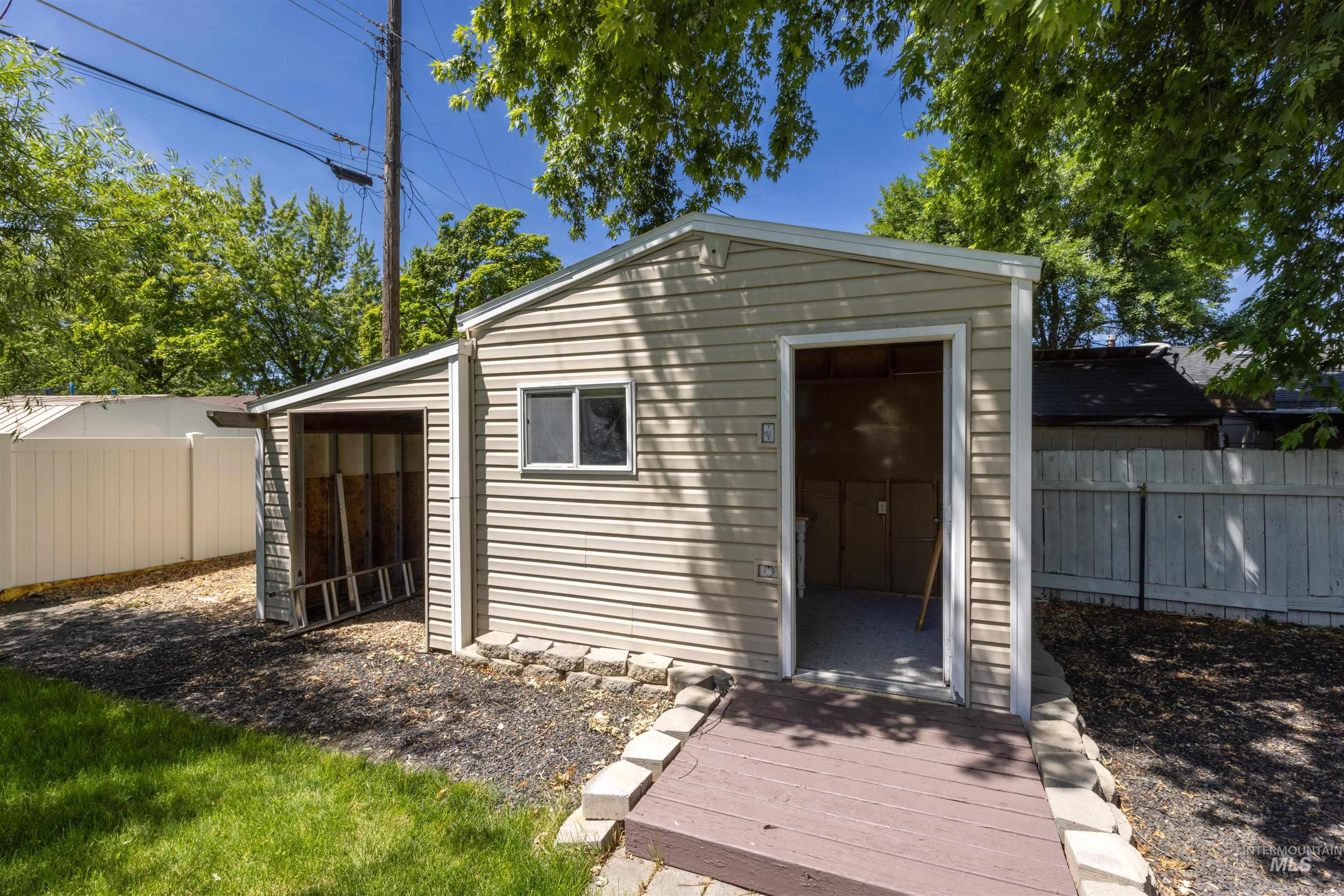 View of outbuilding featuring a fenced backyard