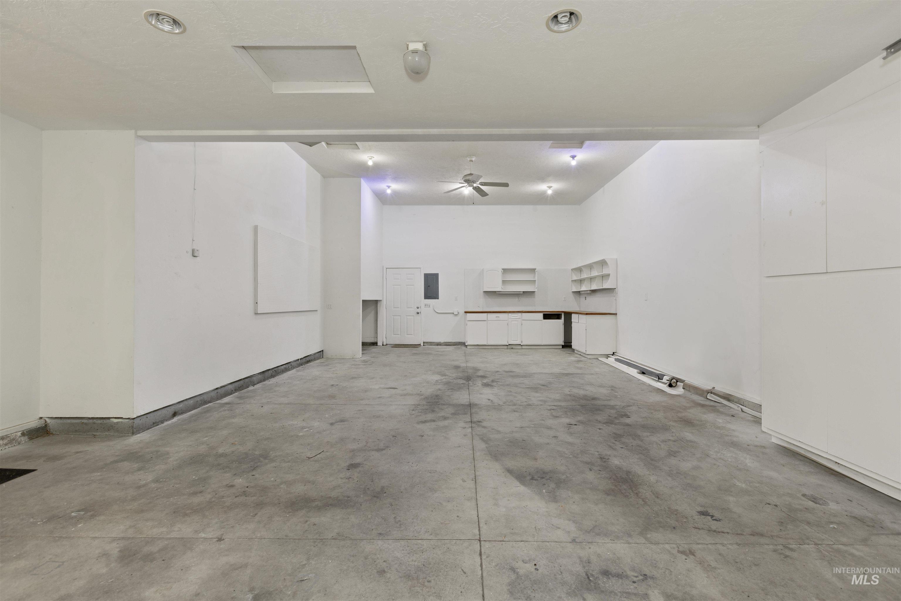 Garage featuring baseboards