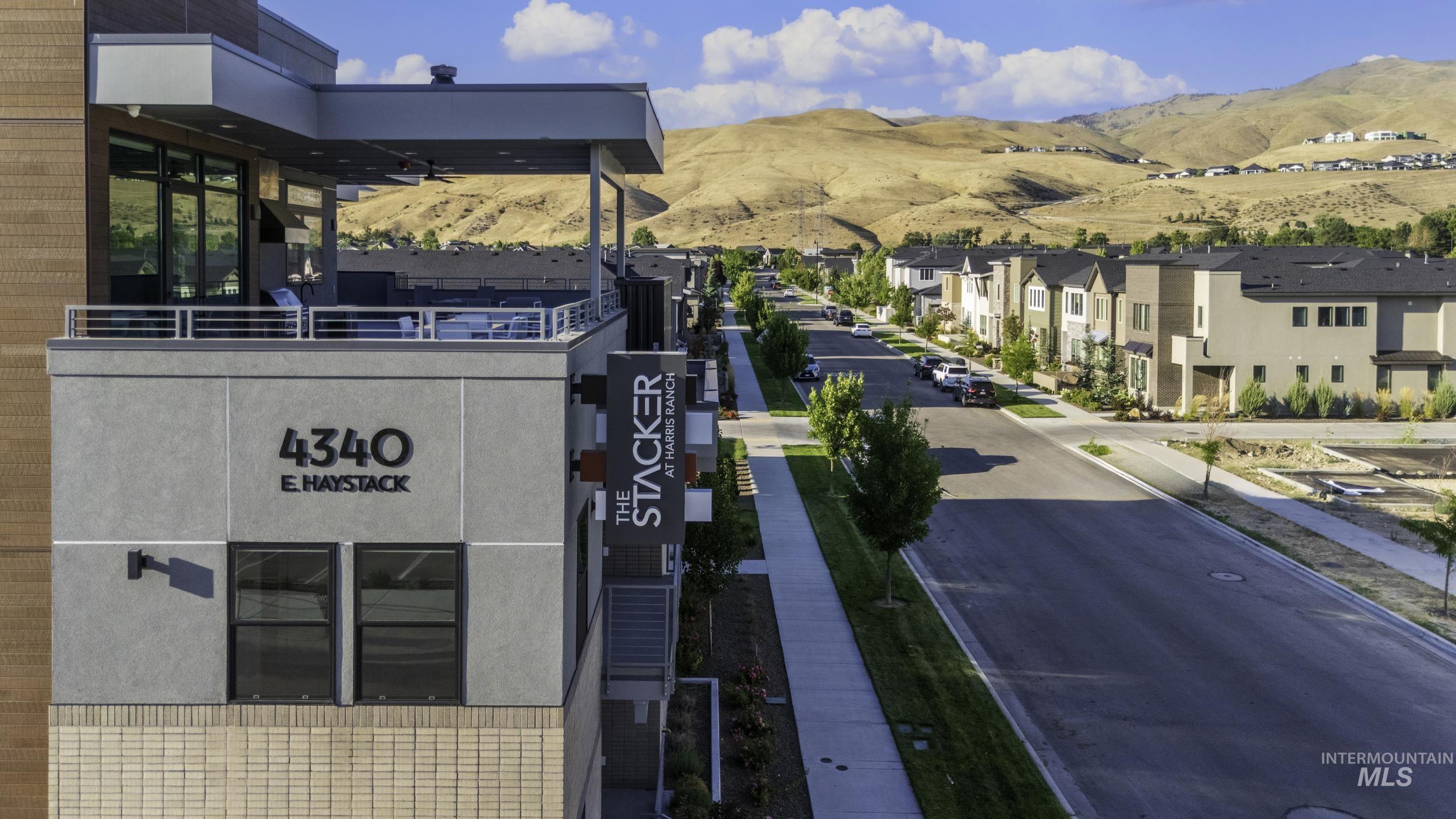 Exterior space featuring a mountain backdrop and a residential view