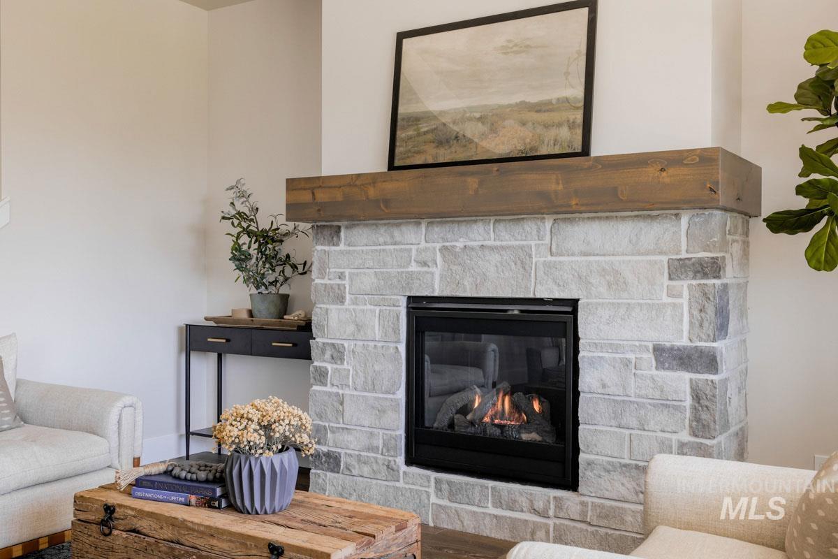 Living room with a stone fireplace