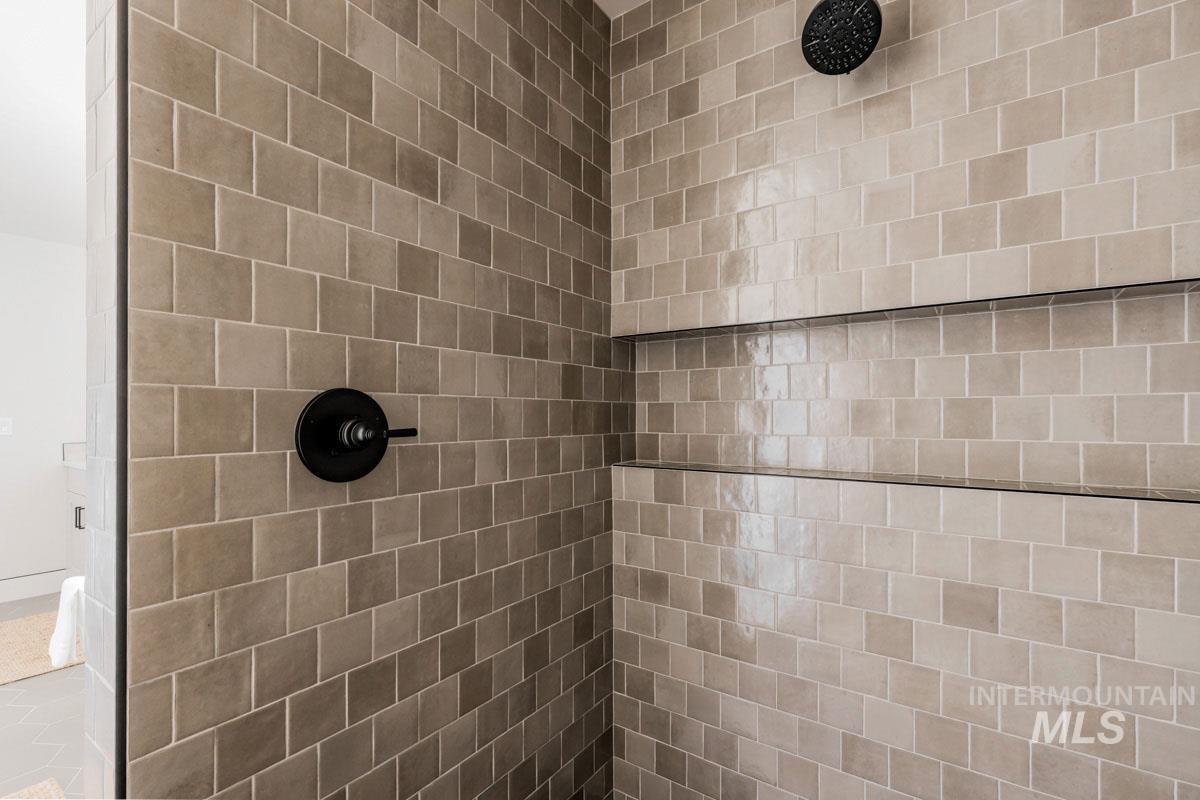 Bathroom view of a tile shower