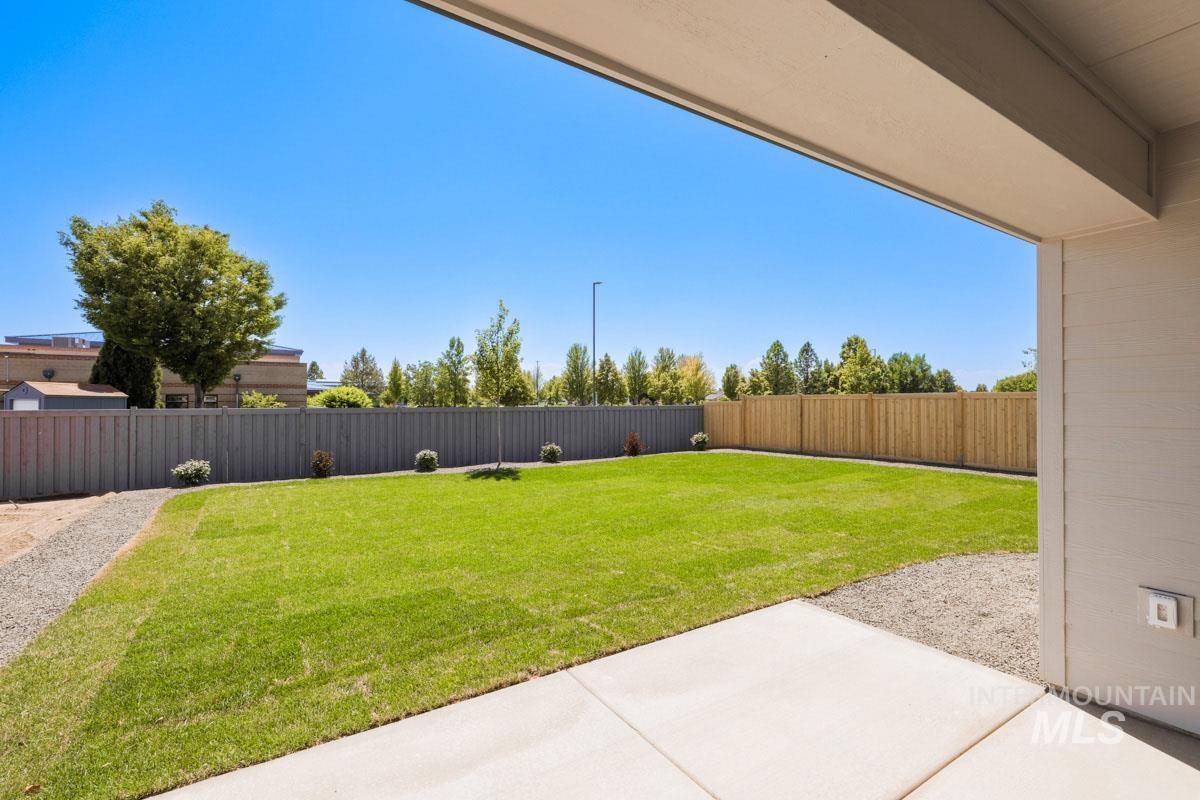 Fenced backyard featuring a patio