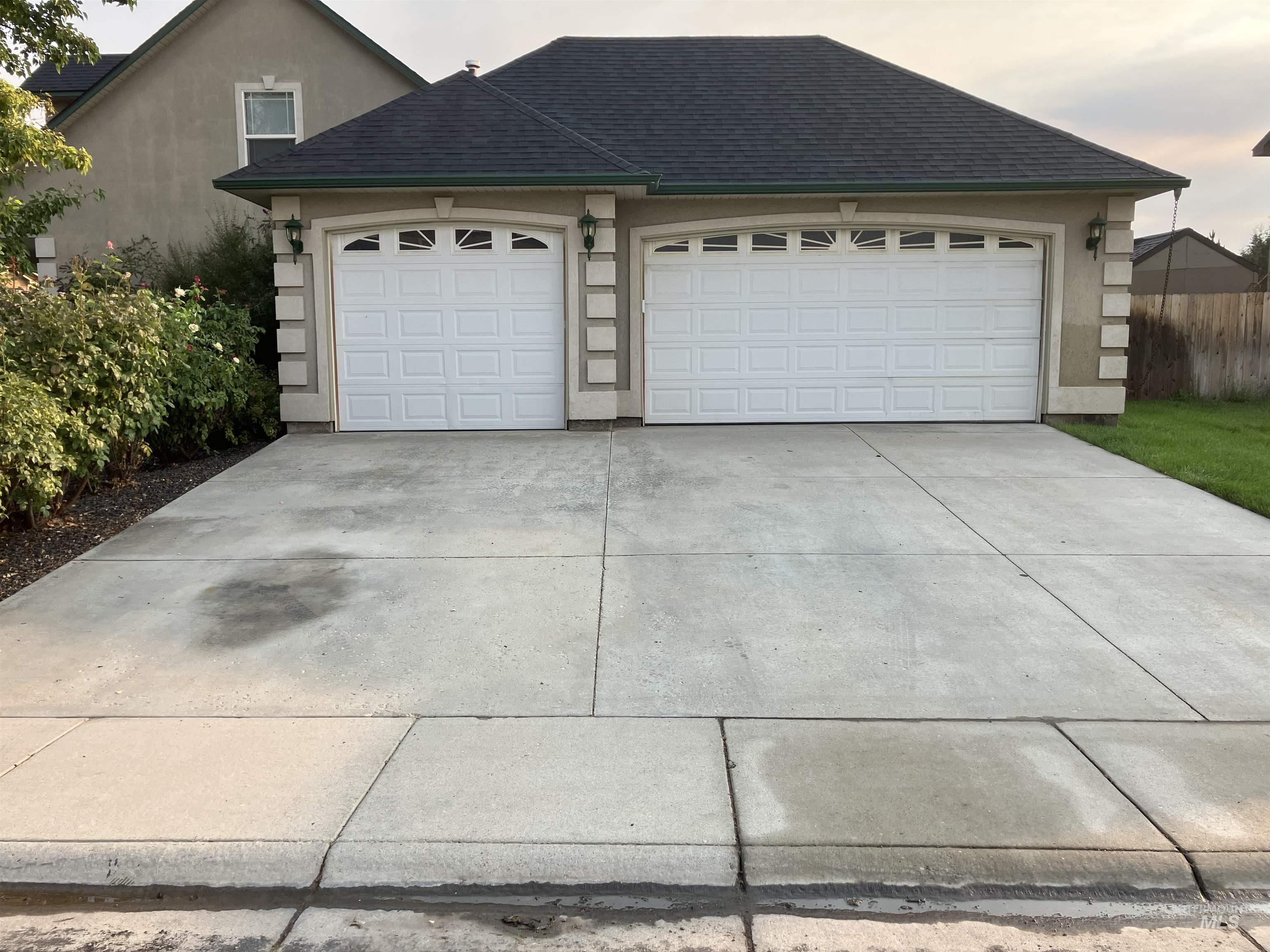 Garage featuring driveway