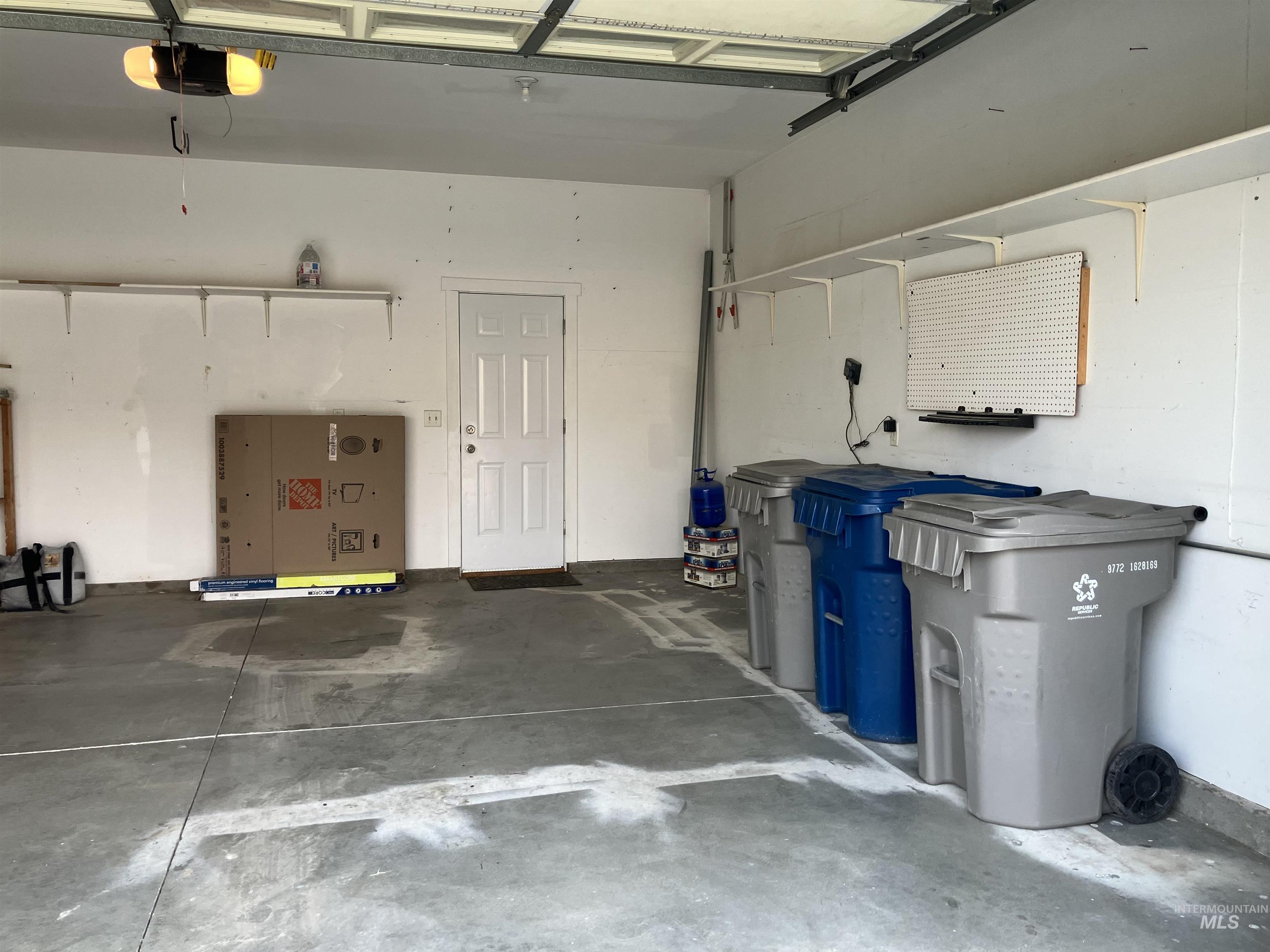 Garage featuring a garage door opener