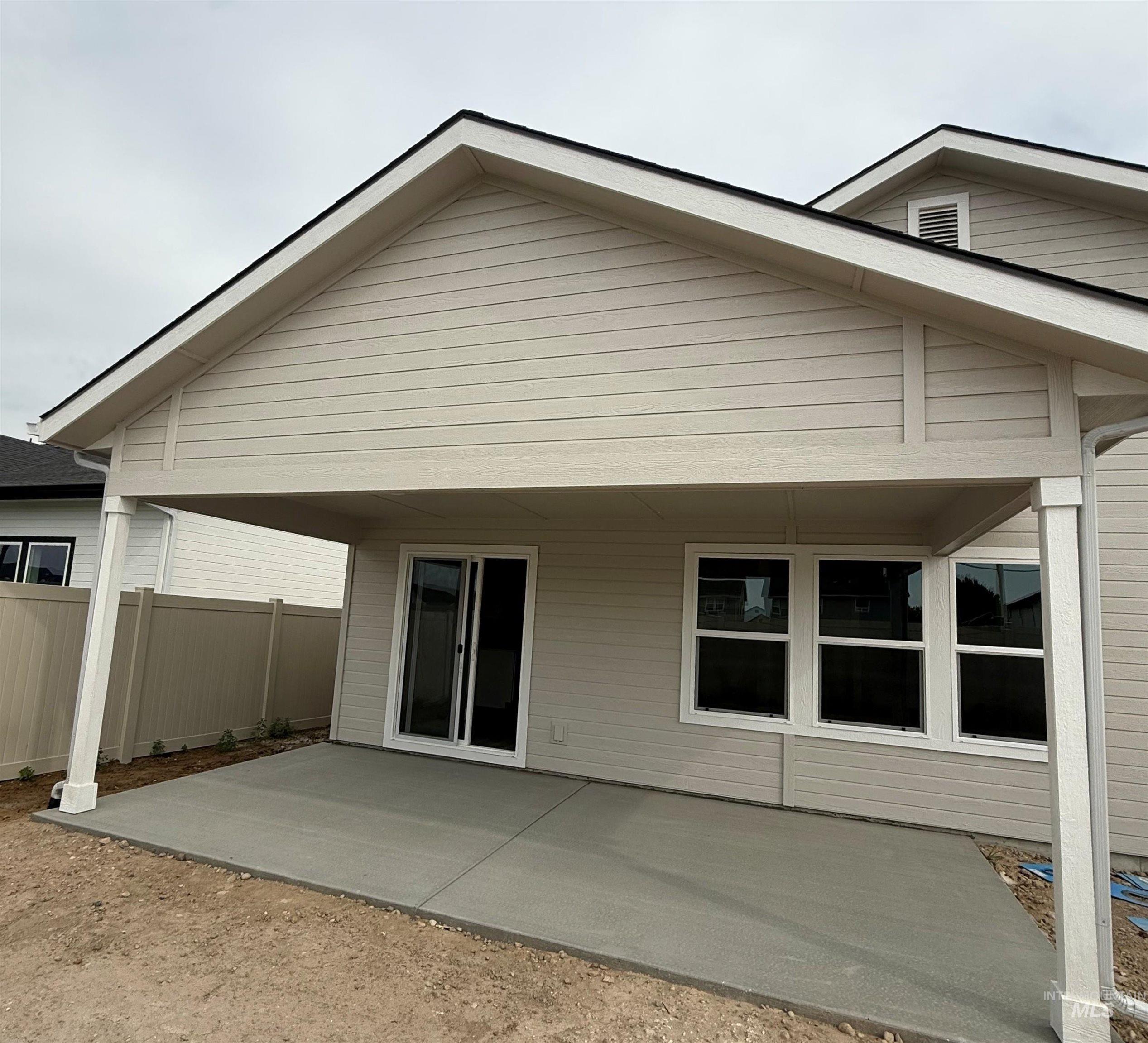 Rear view of house with a patio area