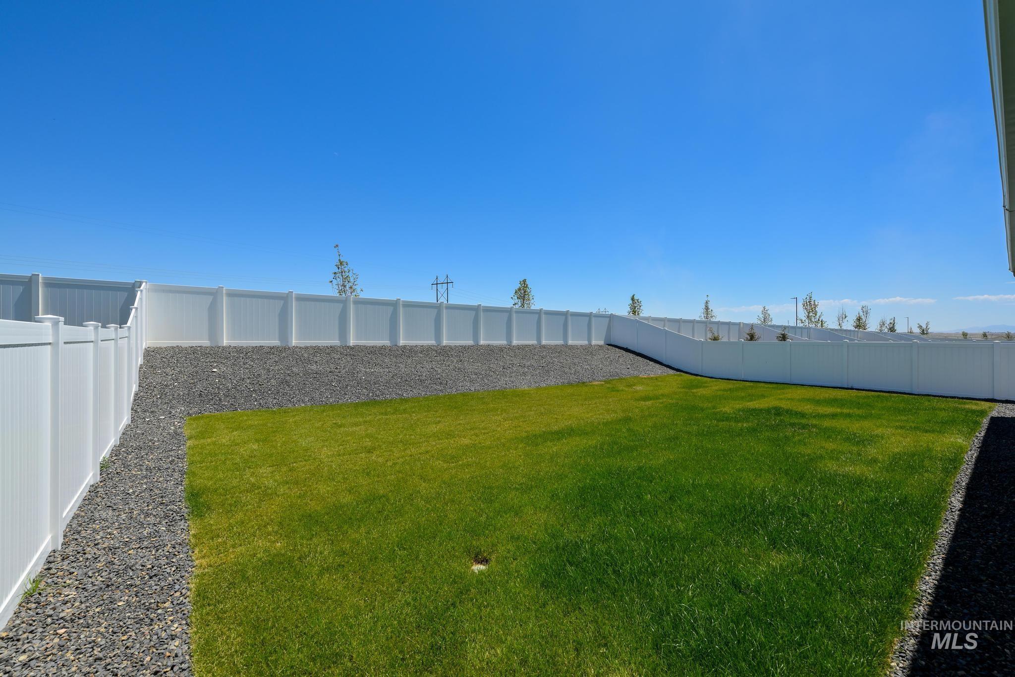 View of fenced backyard