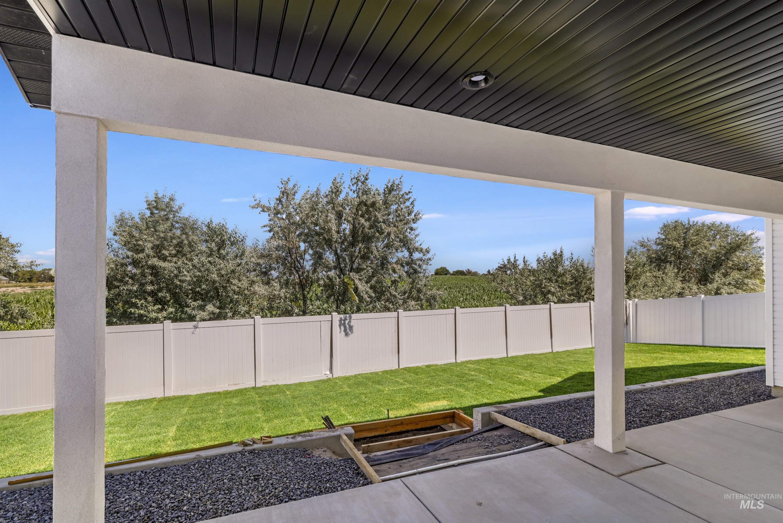 Fenced backyard featuring a patio area