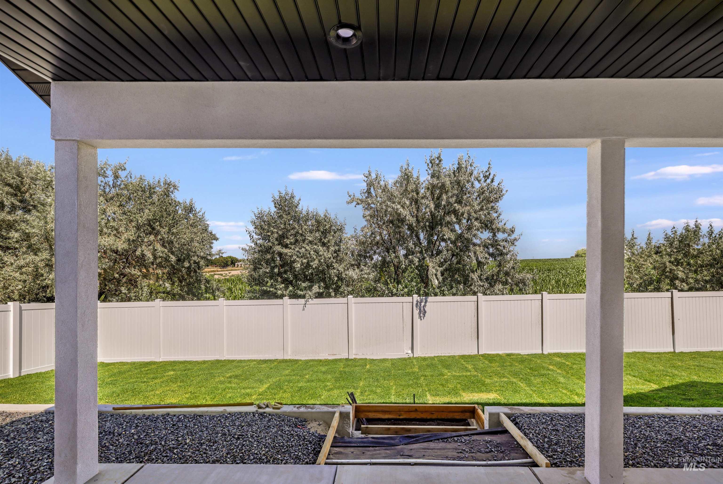 View of fenced backyard