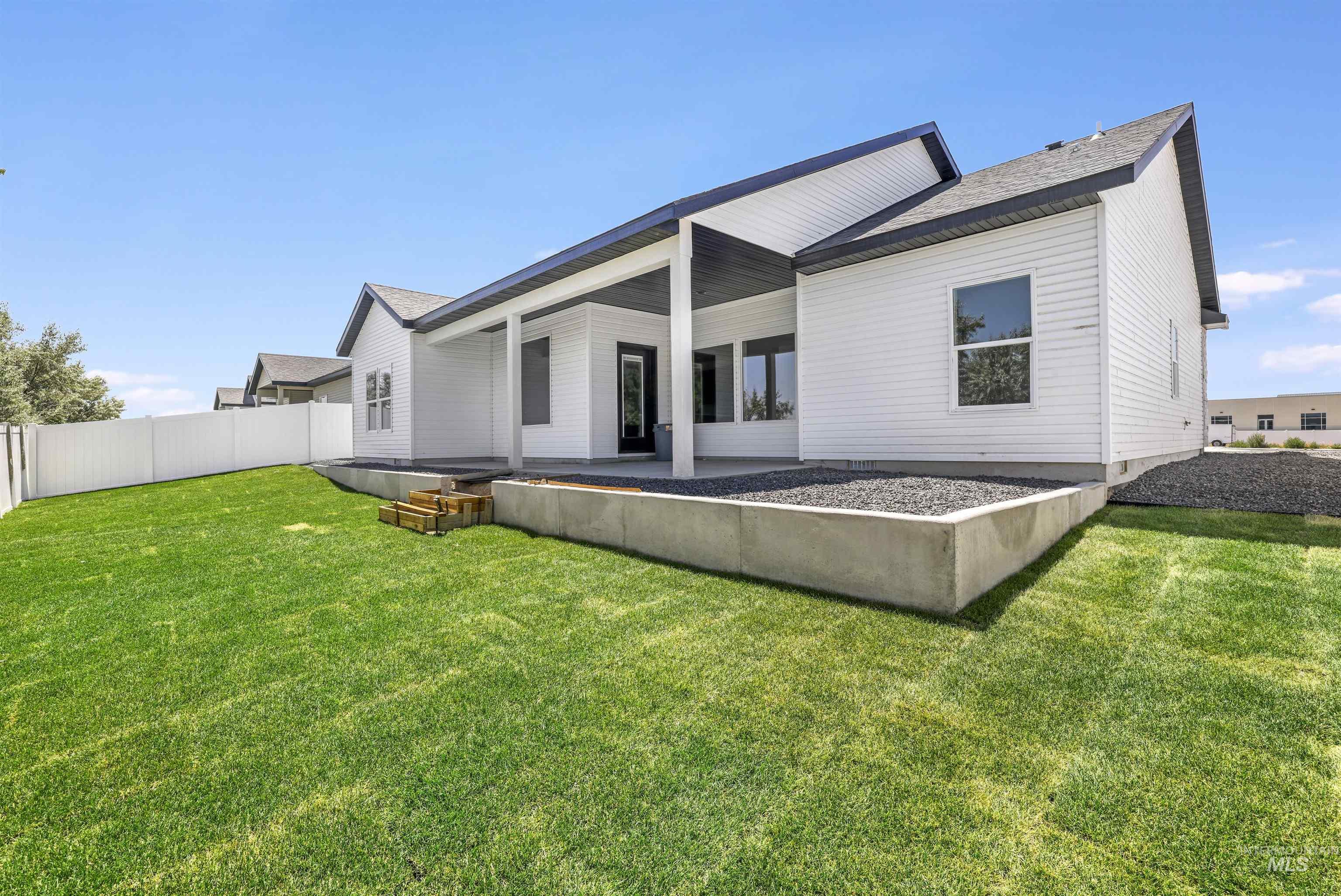 Rear view of house featuring a patio