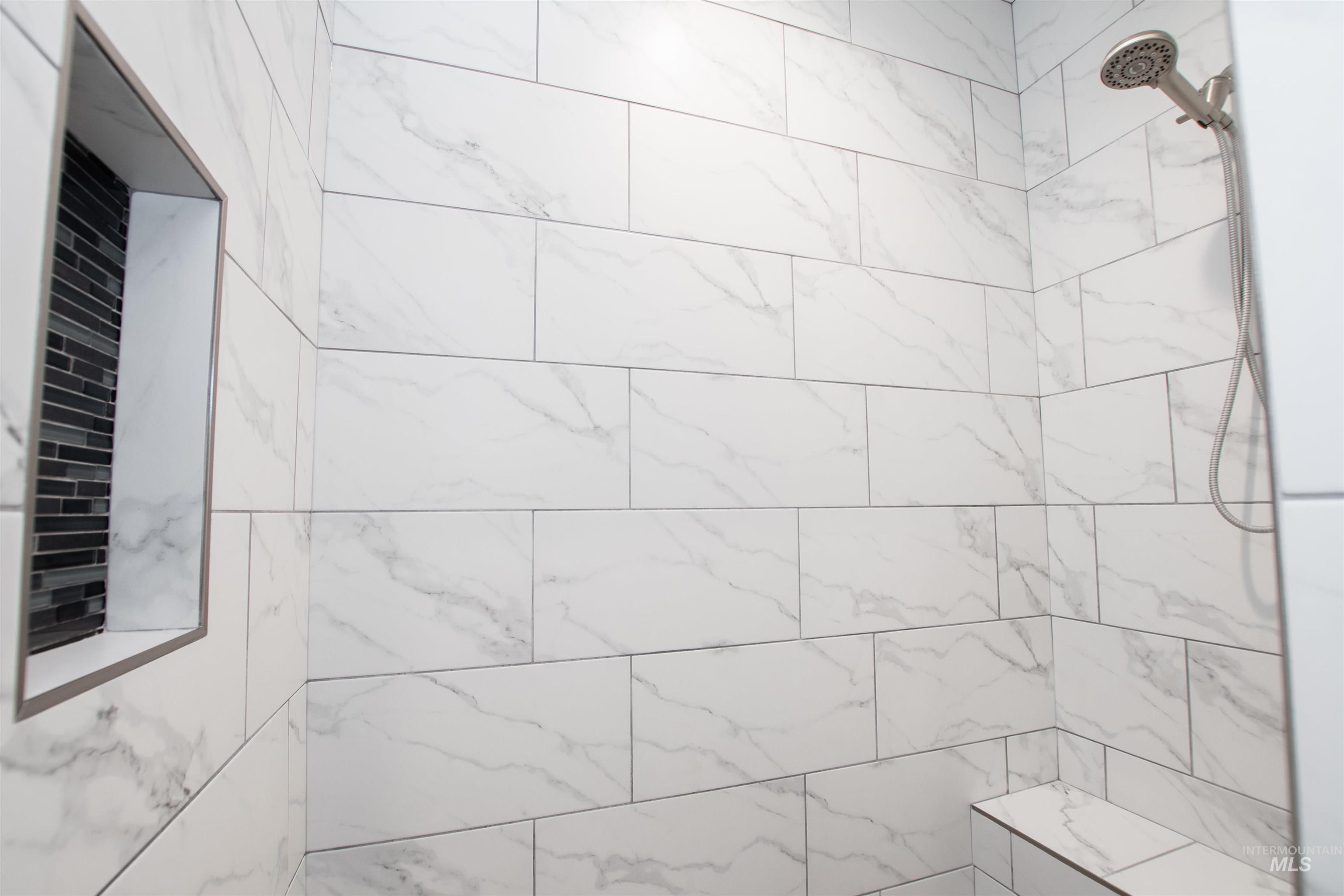 Full bath with a tile shower